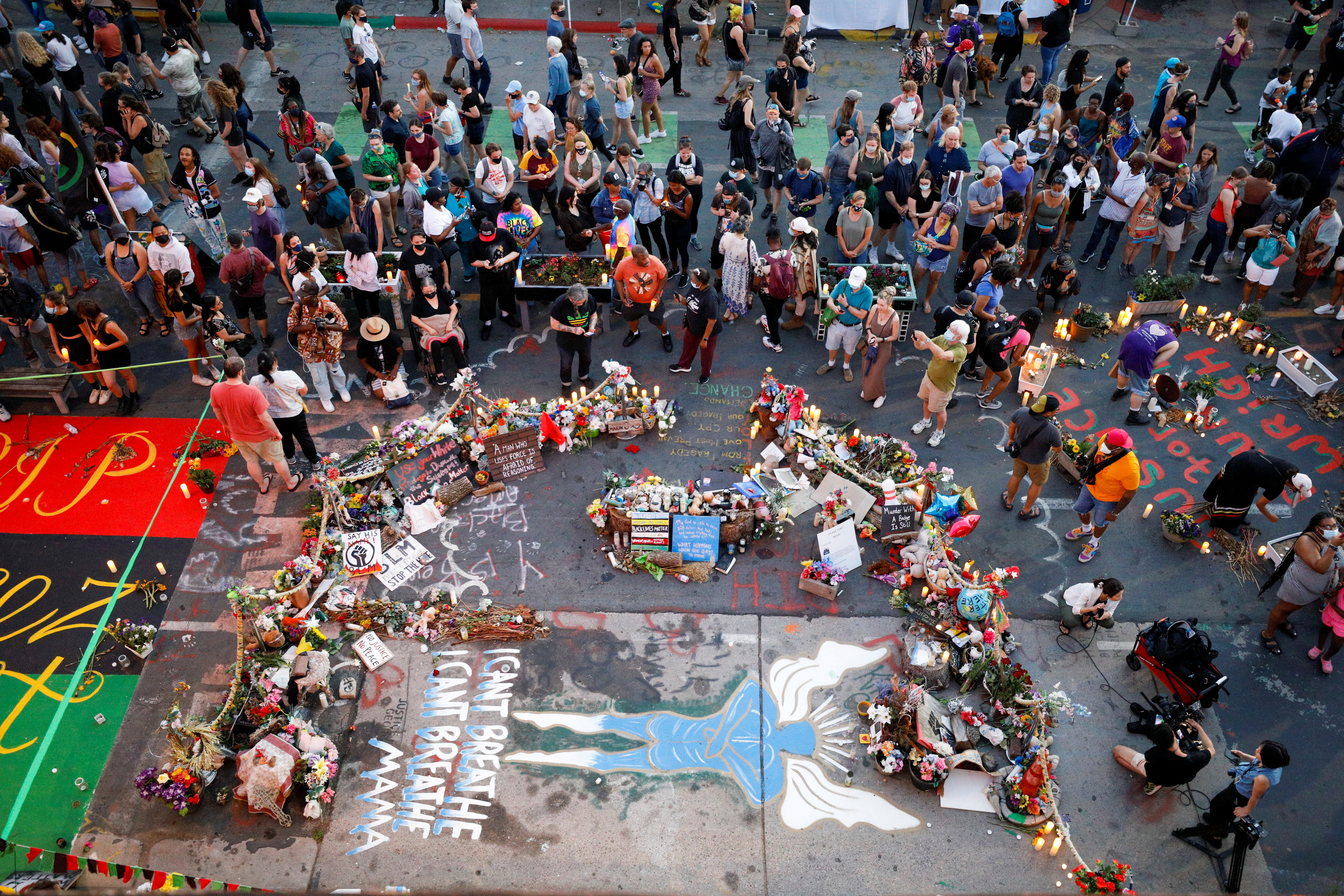 People gather at the George Floyd Square to commemorate the first anniversary of Floyd's death, in Minneapolis, Minnesota, May 25, 2021.REUTERS