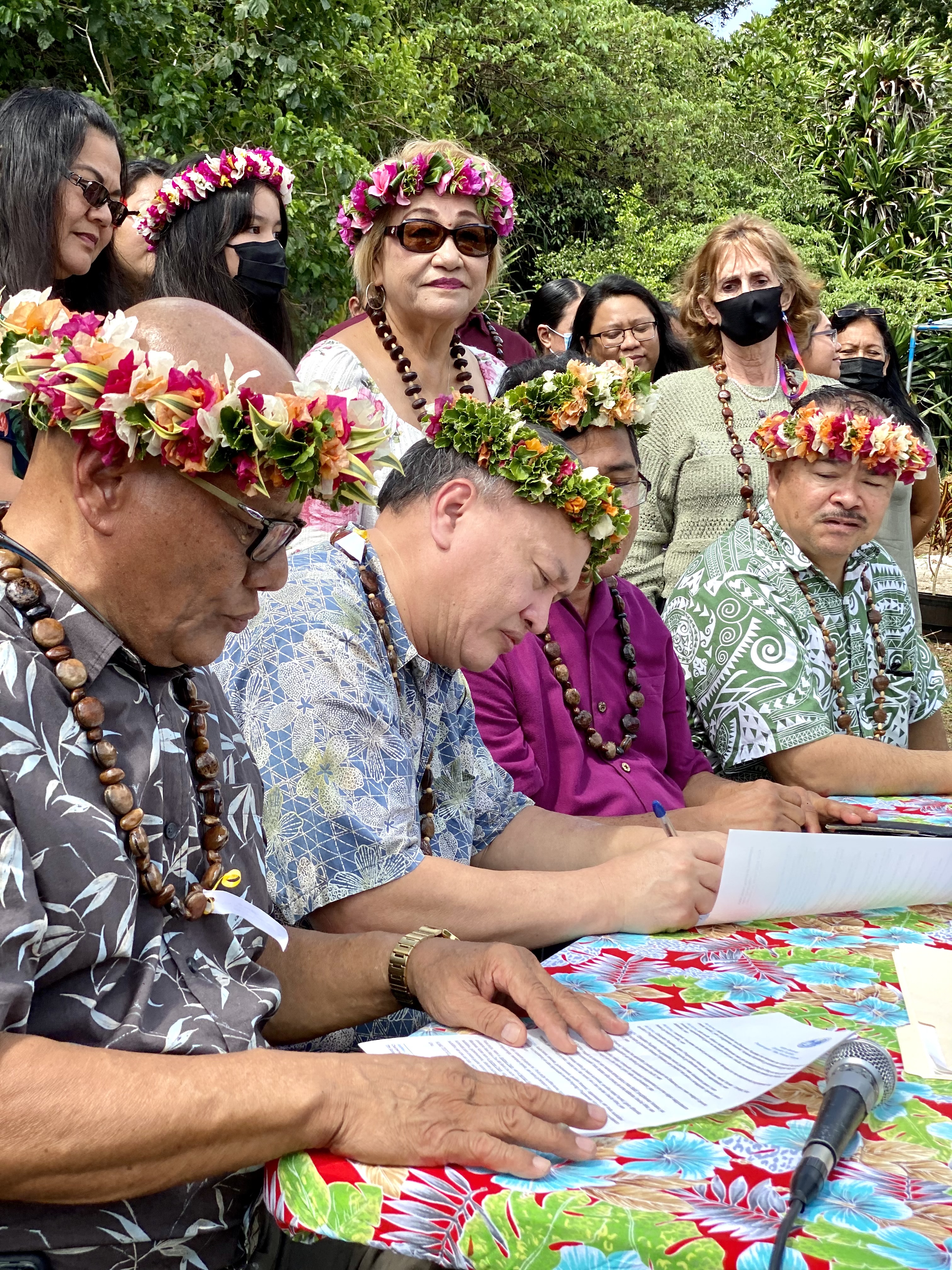 BOE Chairman Andrew L. Orsini signs the Mental Health Awareness Month proclamation with BOE Vice Chairman Herman Atalig. Also in photo: Mayor Efraim Atalig, Commissioner of Education Dr. Alfred Ada and other Rota education leaders.