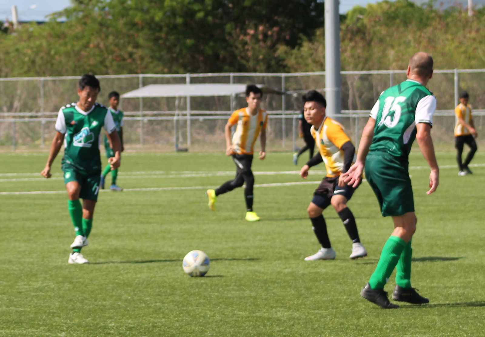 TanHoldings’ Michiteru Mita passes to teammate Tomas Abel during a Men's M-League Spring 2021 game Sunday at the NMI Soccer Training Center.Photo by James F. Sablan Jr.