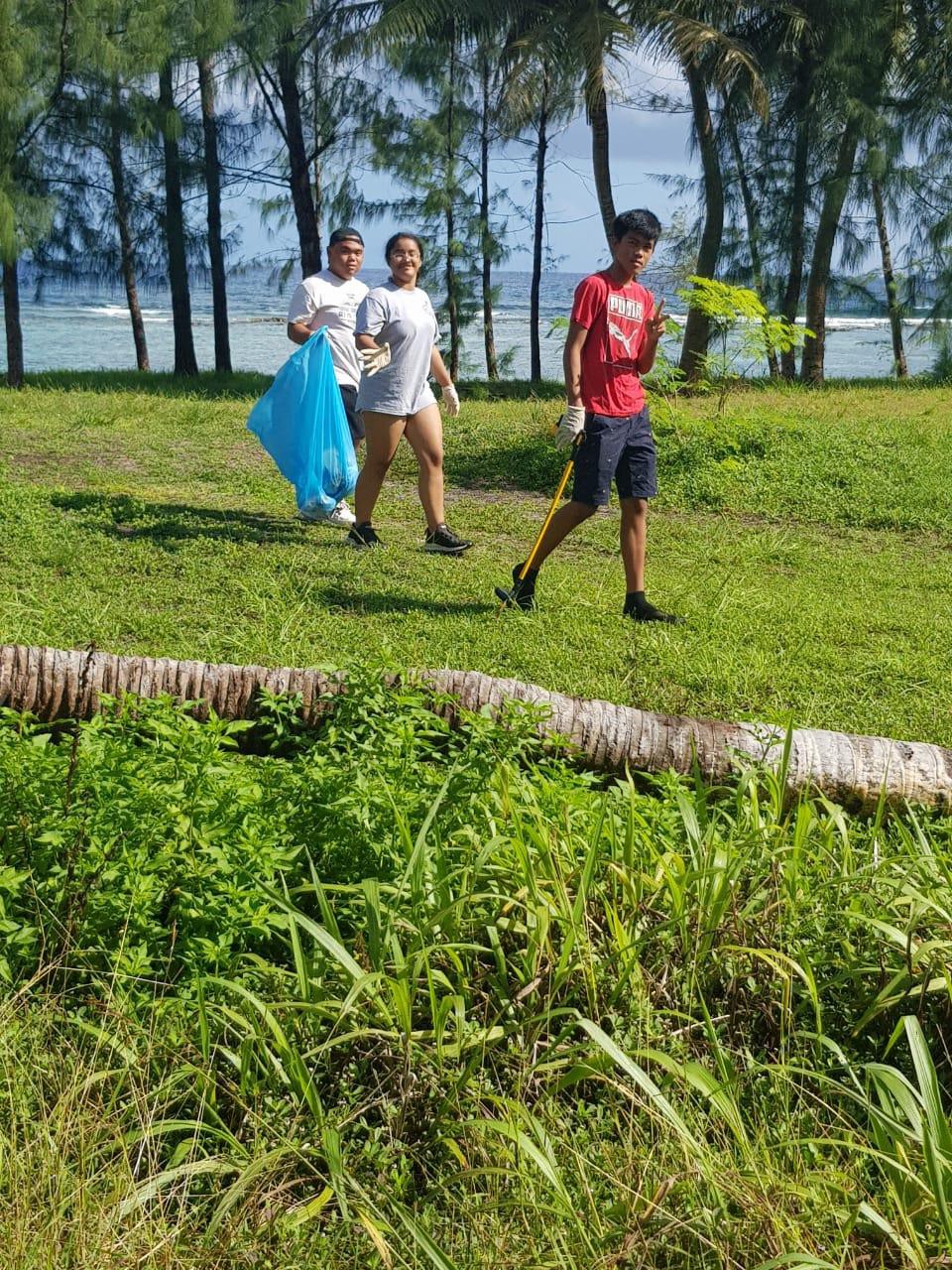 Students   of Dr.  Rita S. lnos  Jr./Sr.   High  School  clean  Guata  Beach  on   Rota  on May 17, 2021, in celebration  of May Tourism Month. MVA photo