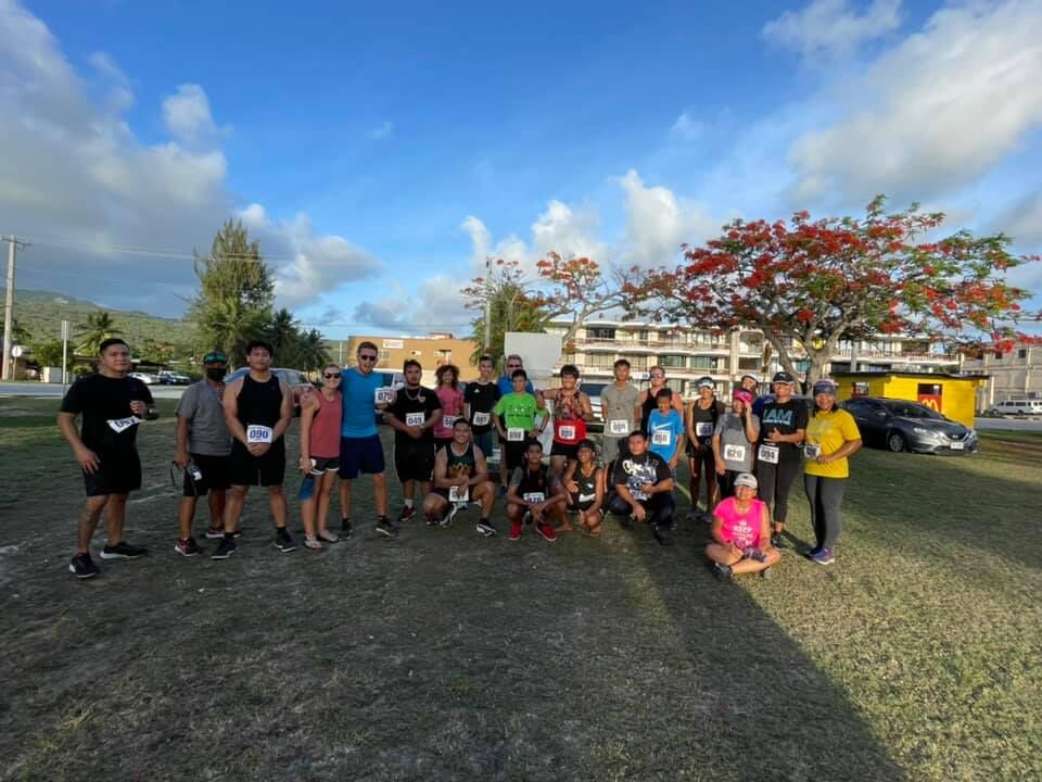 Participants of the Saipan Underground 21.4 5k Beach Road Sunset Run pose for a photo.Contributed photo