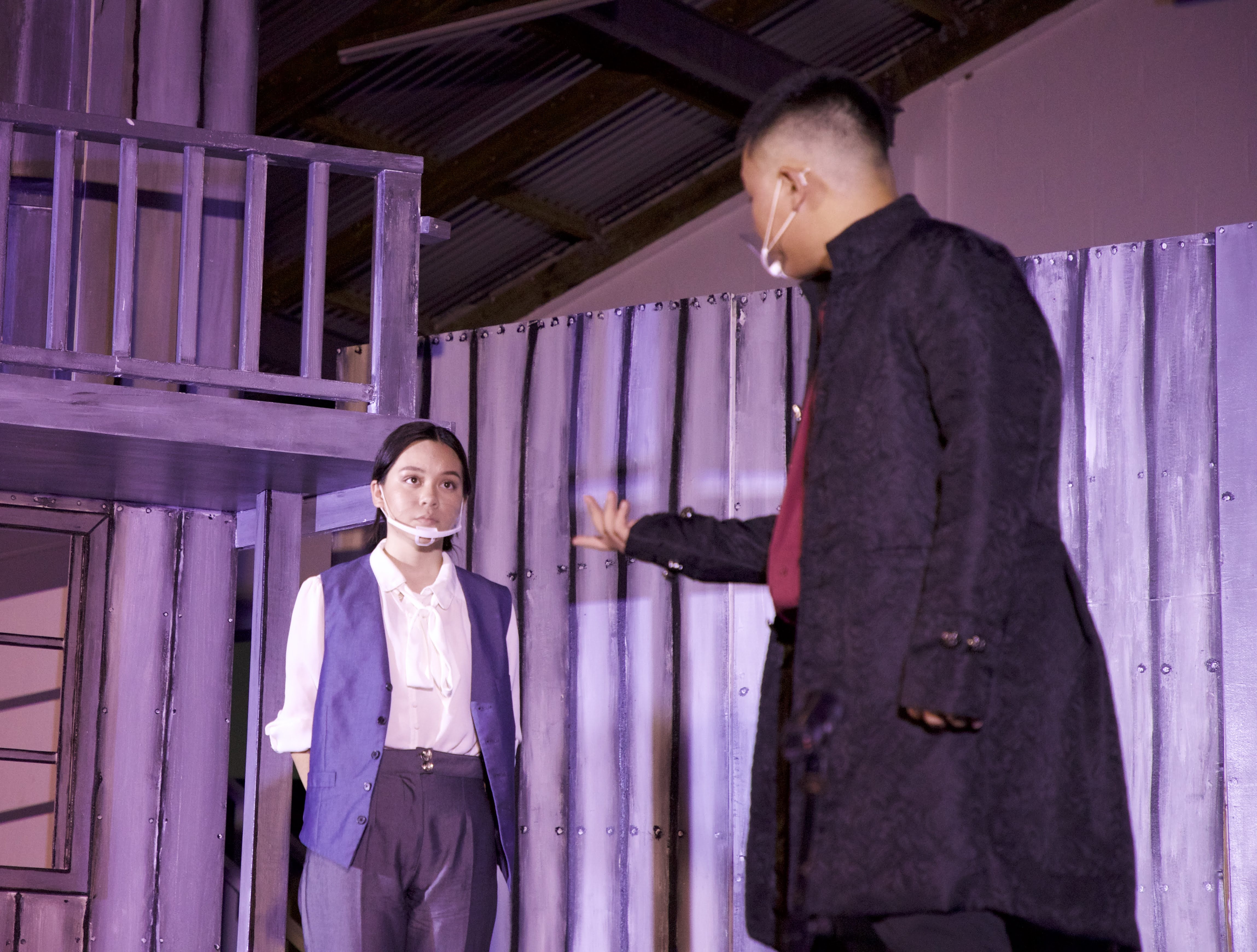 Denise, played by Mount Carmel School eighth-grade student Malina Tenorio, left, takes orders from Oliver, who is played by MCS junior Christian Guerrero, right.