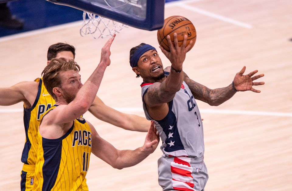 Washington Wizards guard Bradley Beal (3) scores with a reverse layup during the second half against the Indiana Pacers at Bankers Life Fieldhouse in Indianapolis, Indiana,  May 8, 2021.Photo by Doug McSchooler-USA TODAY Sports