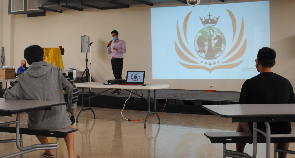 International Chess Club president Joseph Zhang delivers his remarks just before the start of the blitz tournament Saturday in the MHS cafeteria.MV photo