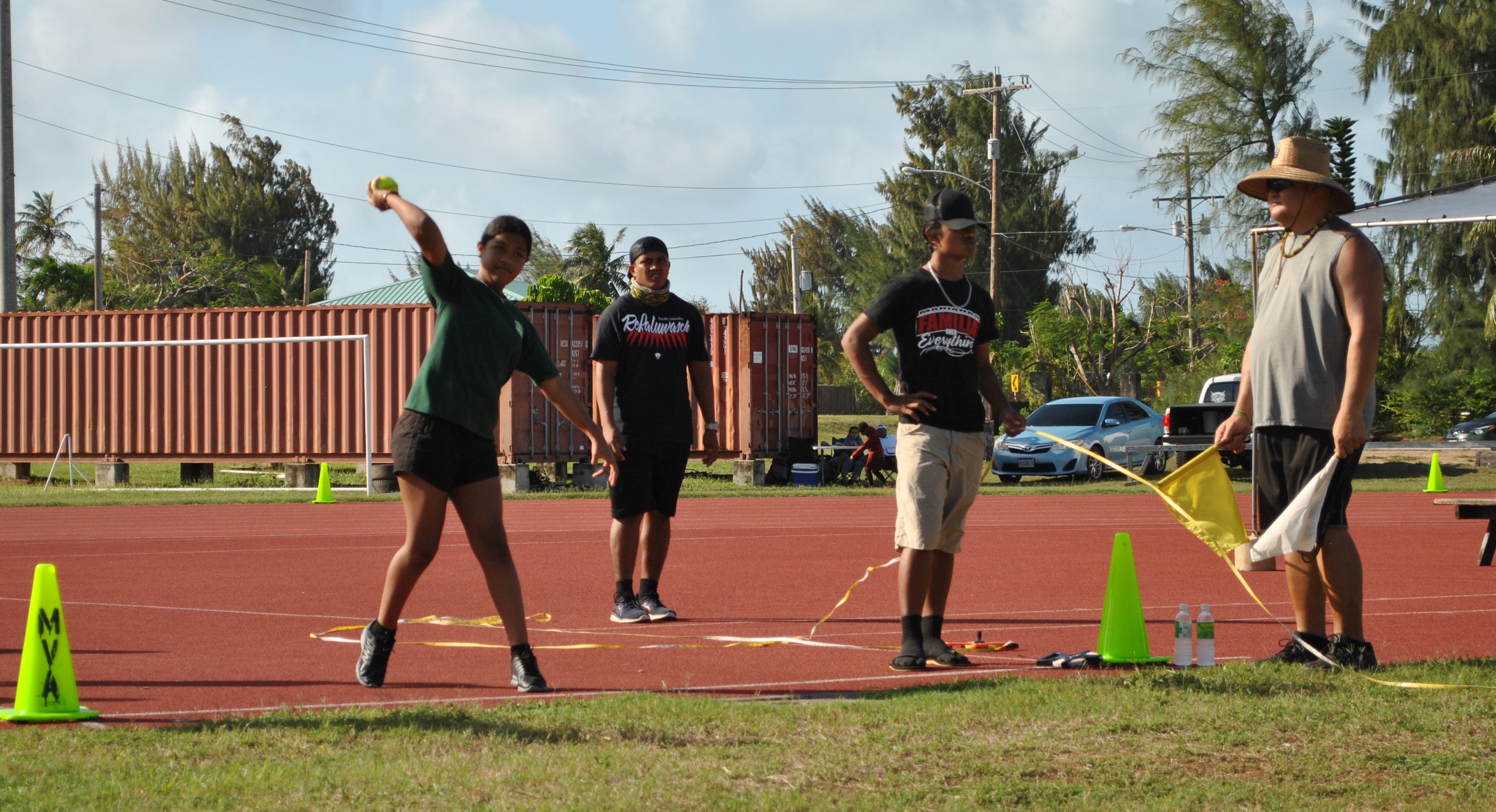 An Oleai Elementary School student attempts the softball throw.