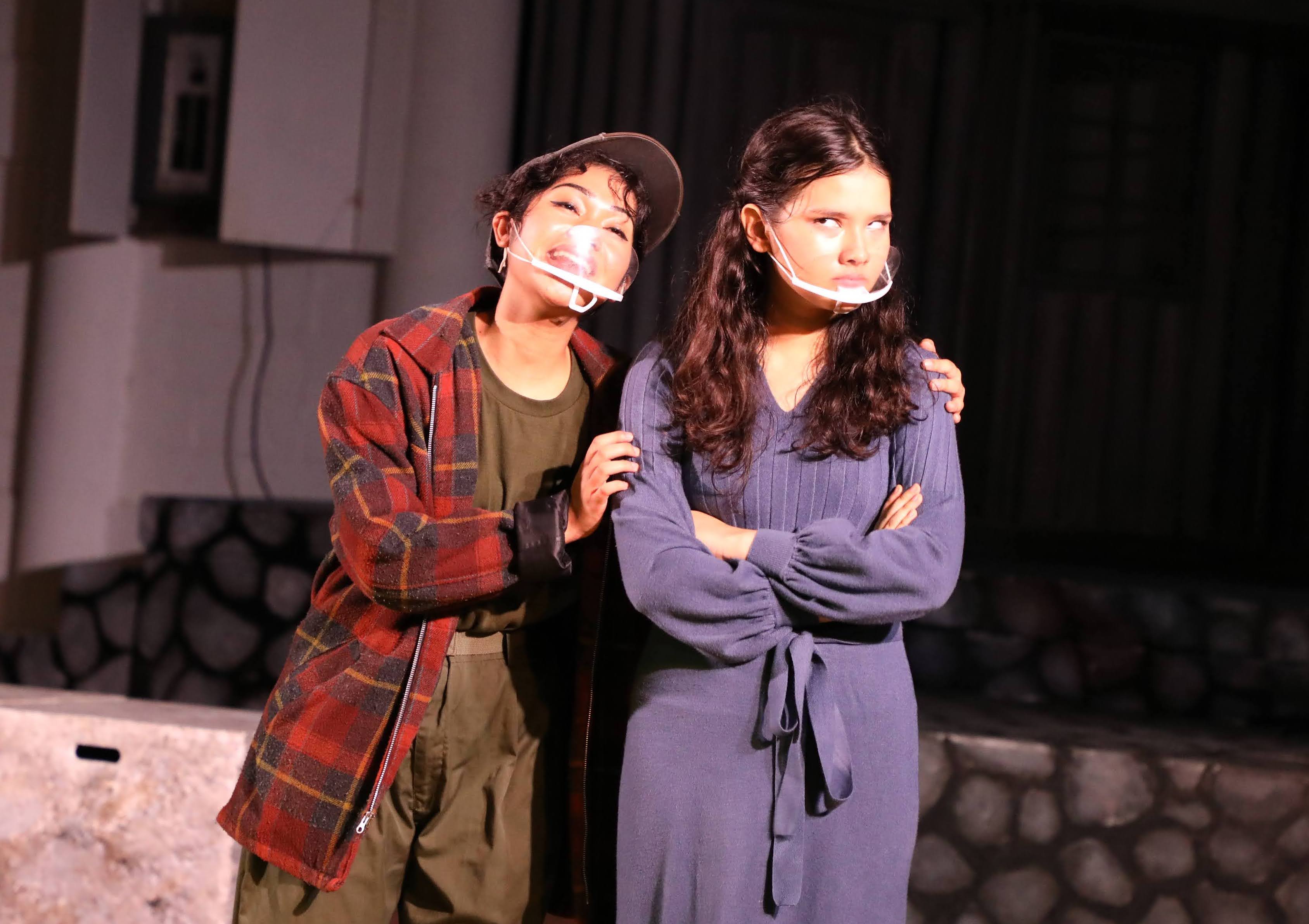 Lead actresses Kina Dela Cruz, left, and Raven Driver, right,  perform a scene about the frustration of acquiring true love.