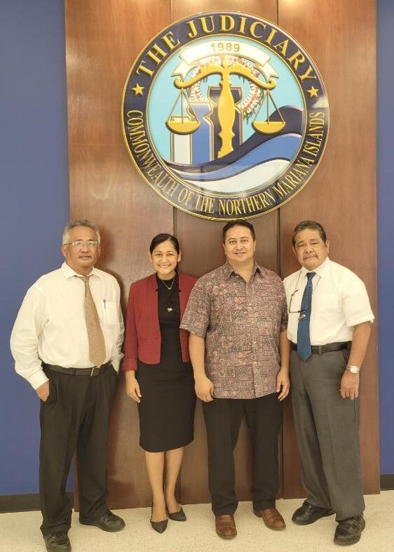 From left, Superior Court Presiding Judge Roberto C. Naraja, first lady Diann T. Torres, Gov. Ralph DLG  Torres and CNMI Supreme Court Chief Justice Alexandro Castro pose for a photo with the new judiciary seal as backdrop on May 14 at the Guma Hustisia.Photo by Bryan Manabat