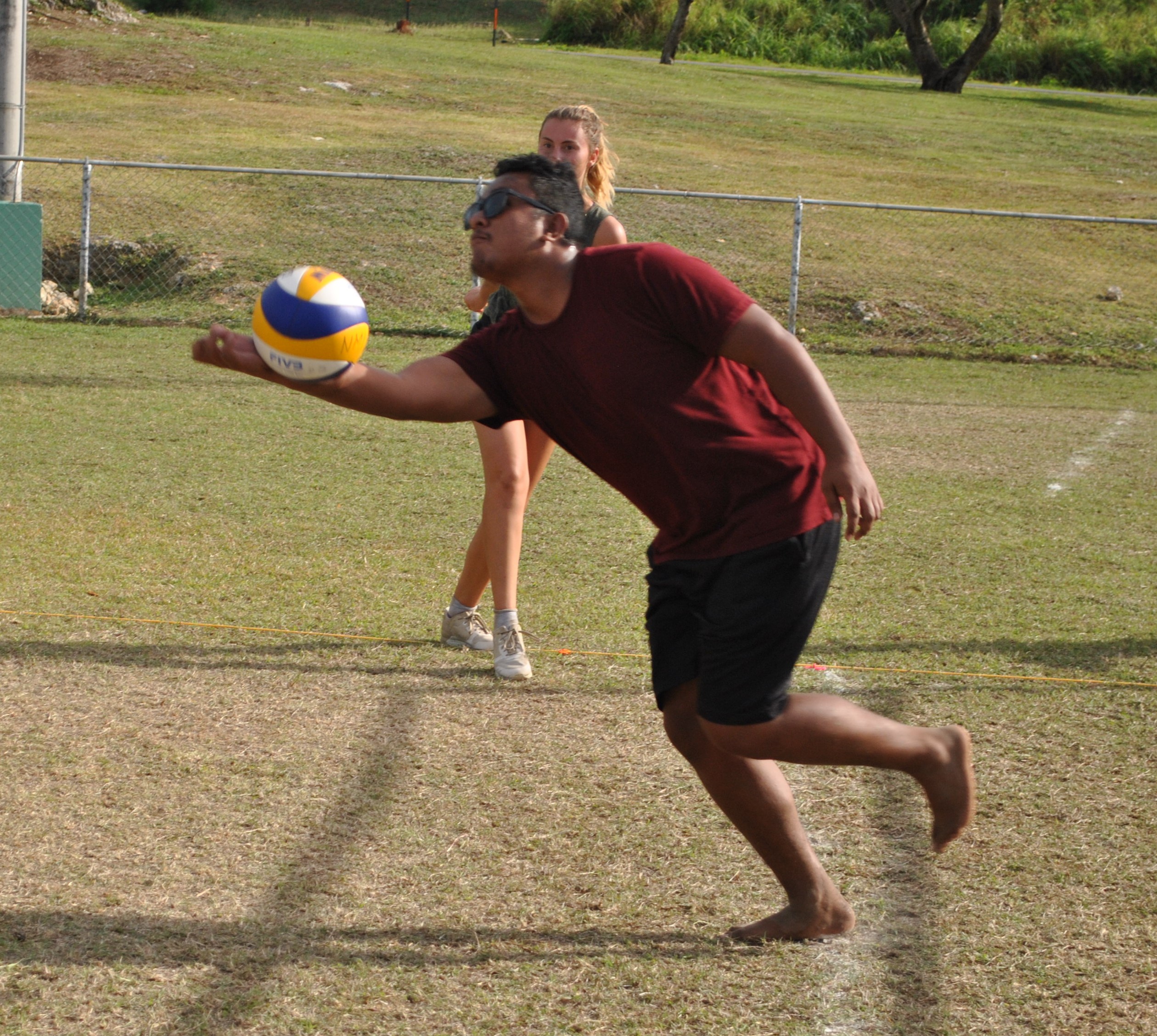 Naks Nakashima extends to save the possession.Photo by James F. Sablan Jr.