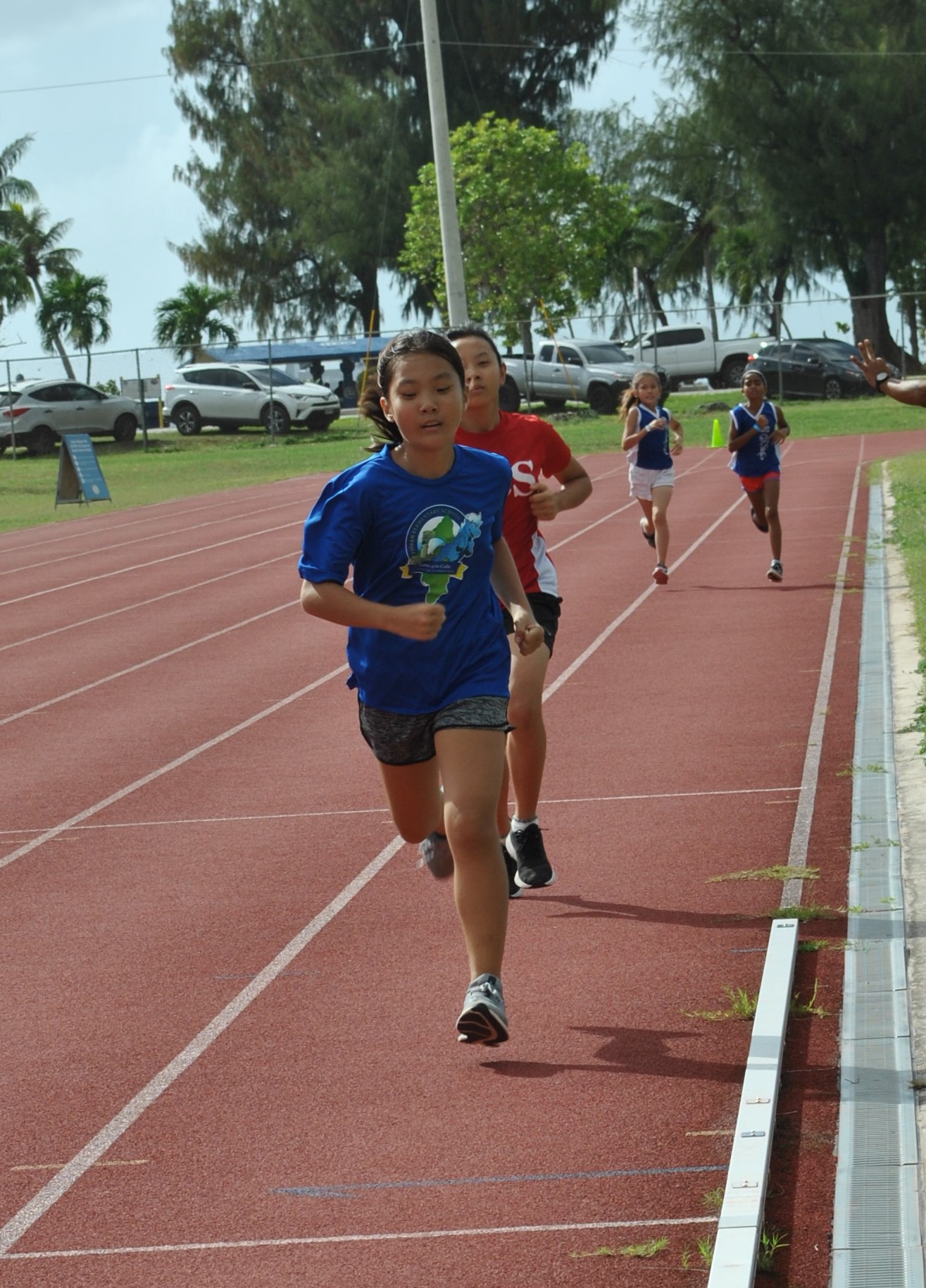 A Tinian student leads the U9 1500m event.