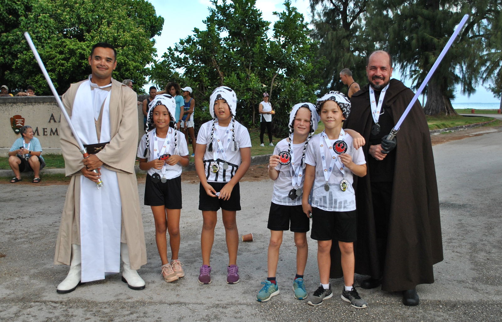 Edward Dela Cruz, left, and Galvin Deleon Guerrero, right, pose with young Storm Troopers.Photo by James F. Sablan Jr.