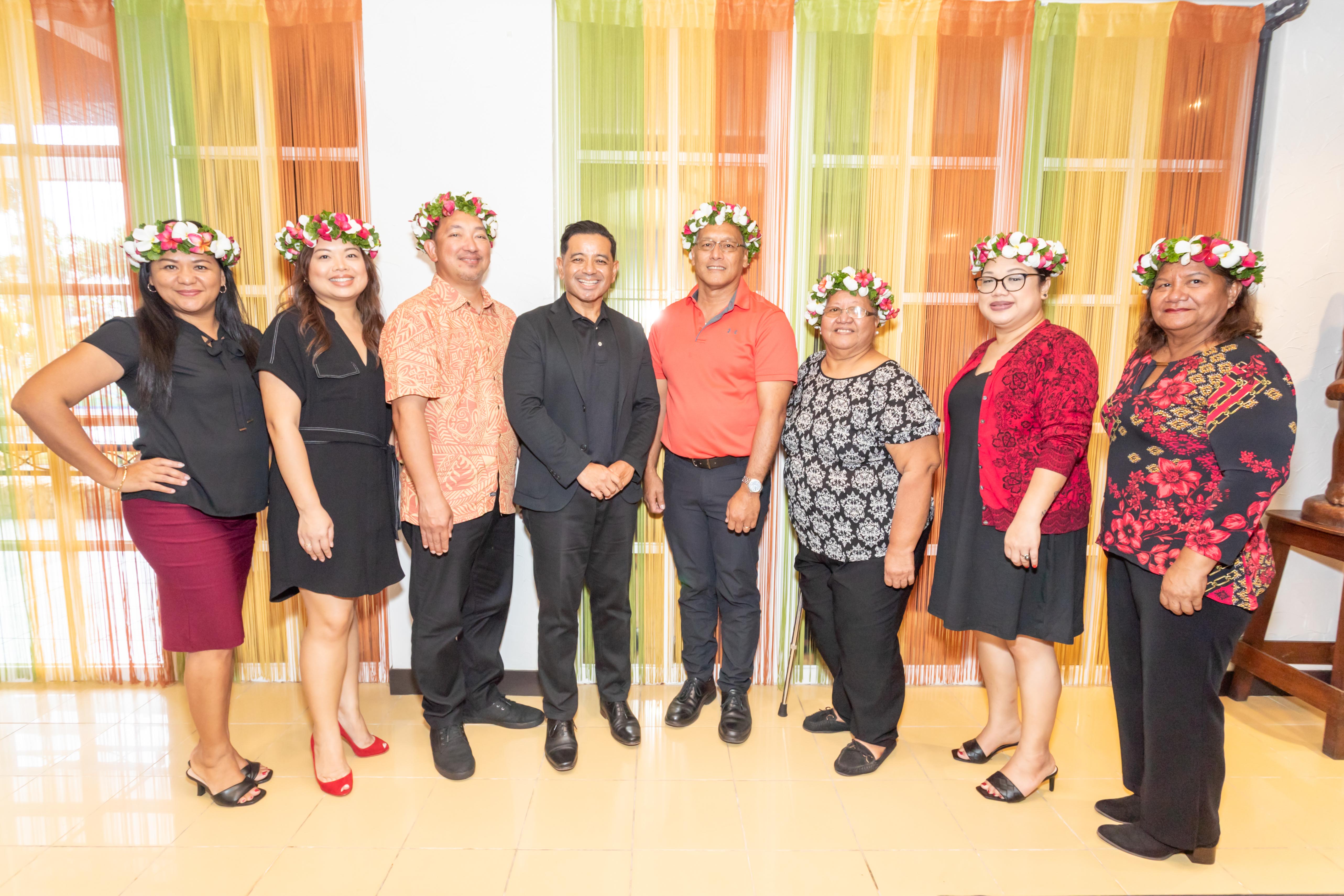 The NMC Regents and Interim President Frankie Eliptico, fourth left, pose for a photo before the start of the commencement exercises.