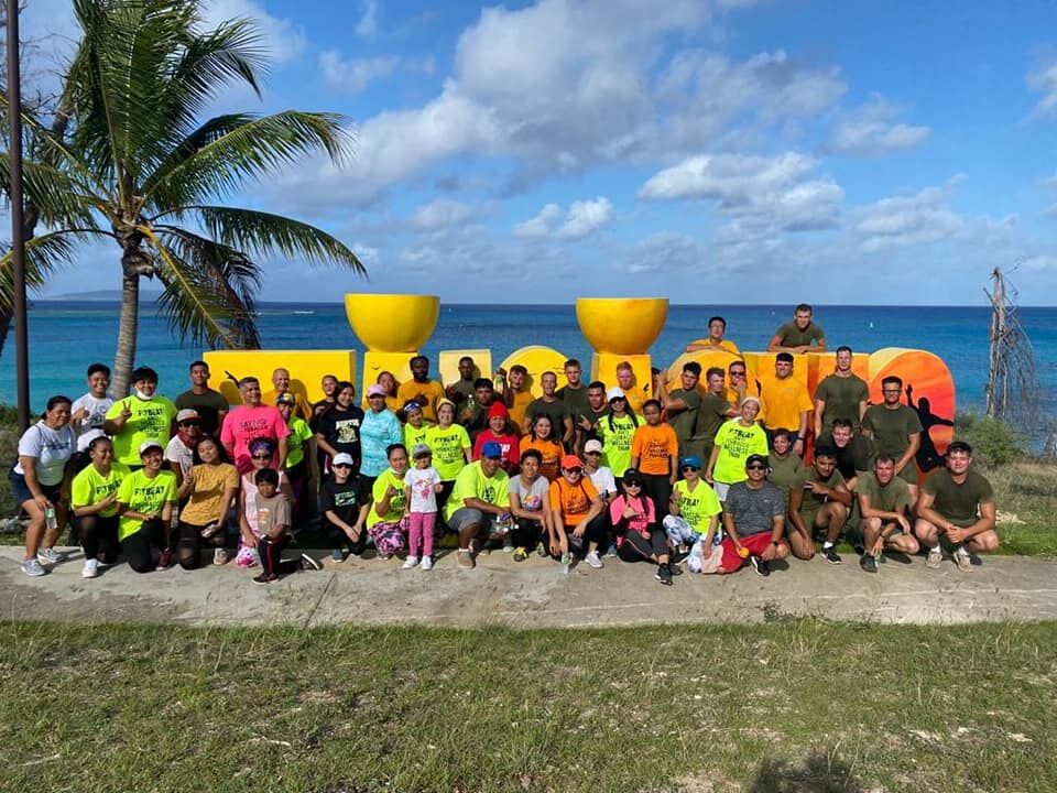 Members of the Naval Mobile Construction Battalion 4 and Marines Corps Tinian Detachment join Tinian residents for a group photo after the Armed Forces Day Hero Fun Run on Tinian on Saturday.Contributed photo