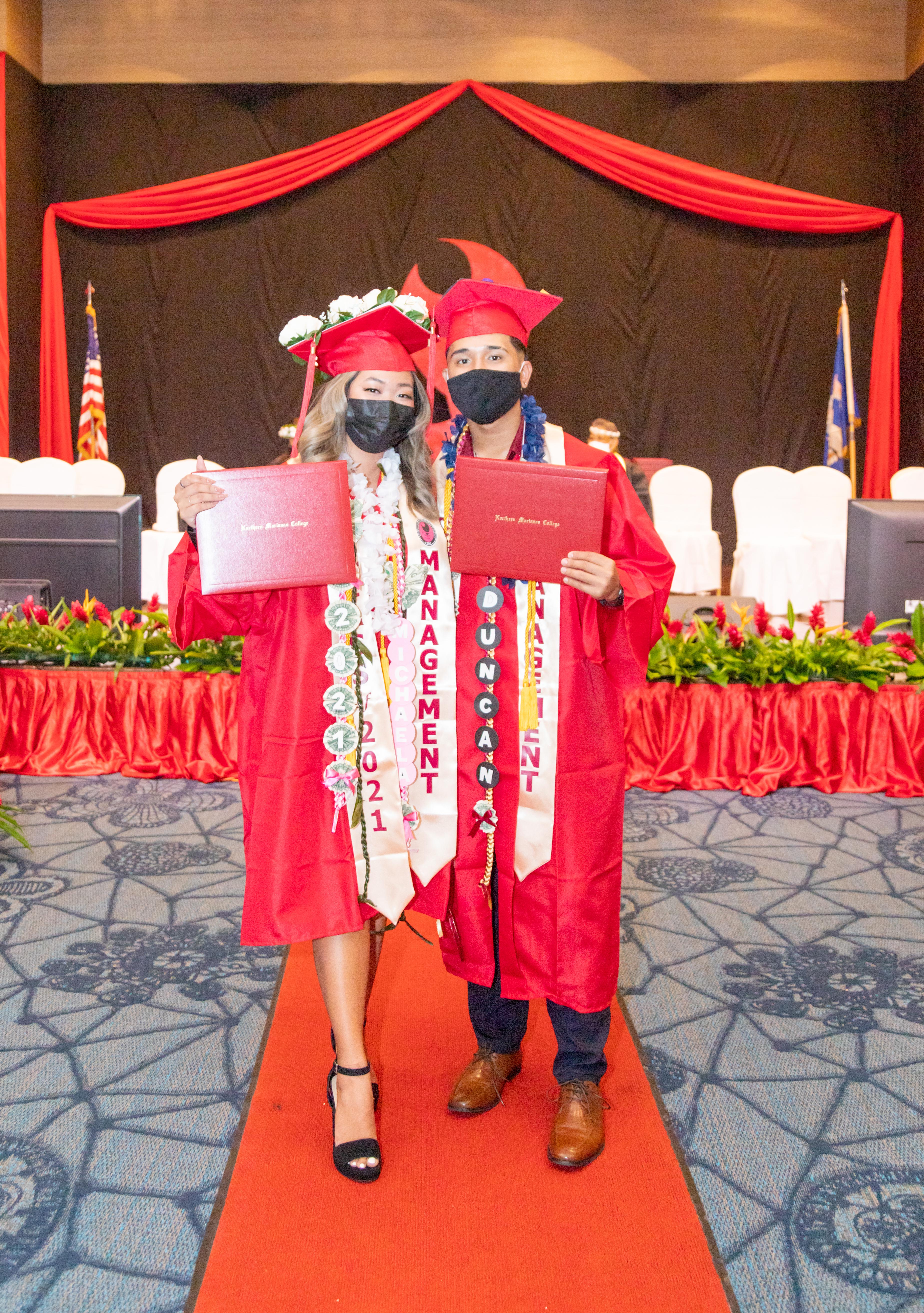 NMC graduates Michaela Gatdula and Duncan Laxa pose for a photo.