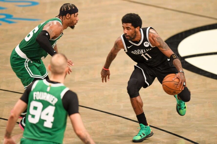 Brooklyn Nets guard Kyrie Irving (11) drives to the basket on Boston Celtics guard Marcus Smart (36) during the fourth quarter of game one in the first round of the 2021 NBA Playoffs at Barclays Center in Brooklyn, New York on May 22, 2021.Photo by Dennis Schneidler-USA TODAY Sports
