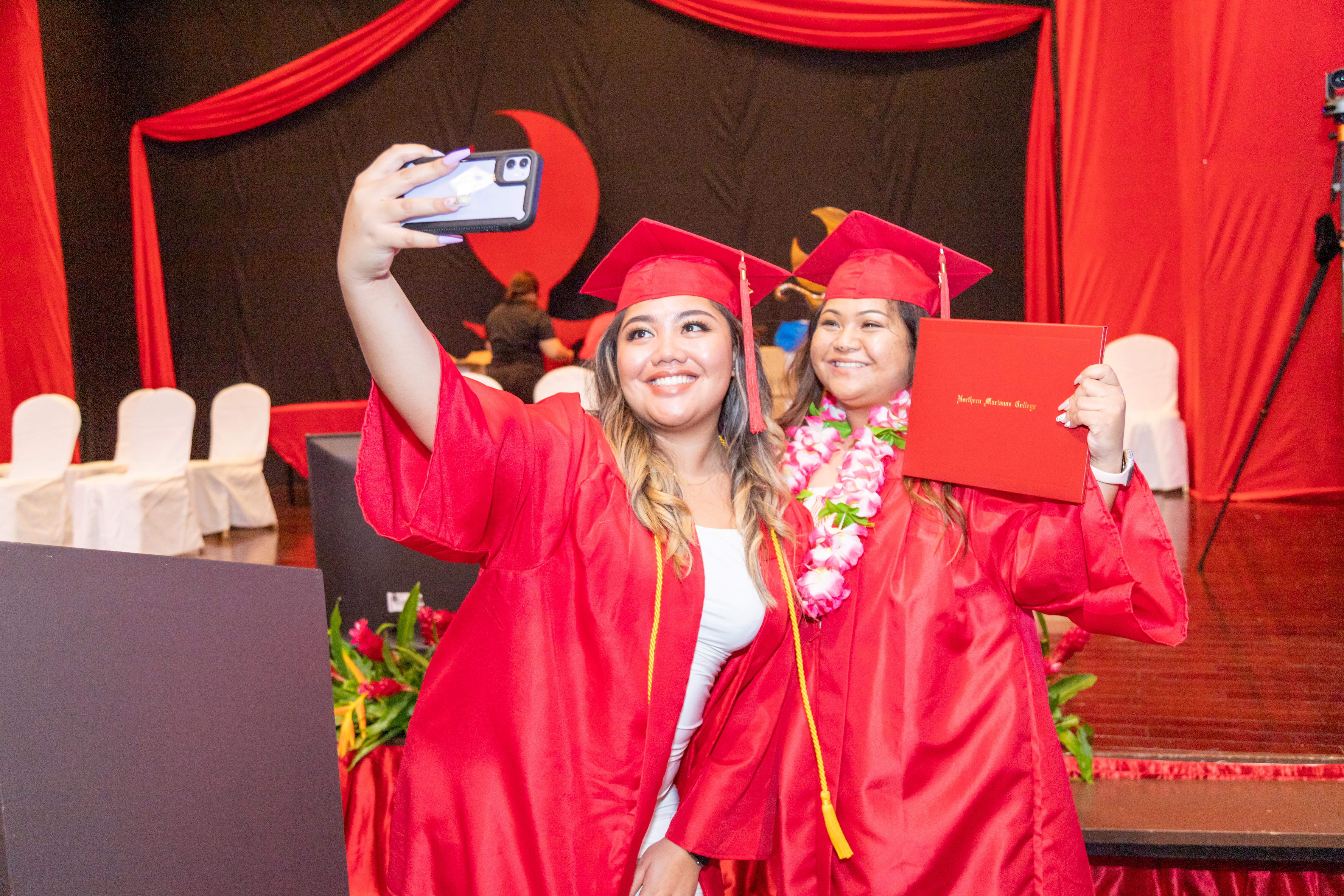 NMC graduates take a selfie.