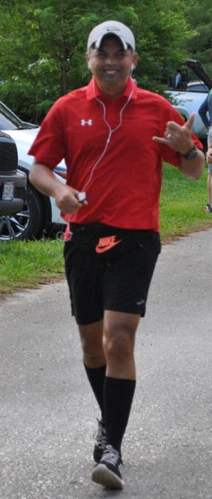 Pastor Eric Abragan crosses the finish line.