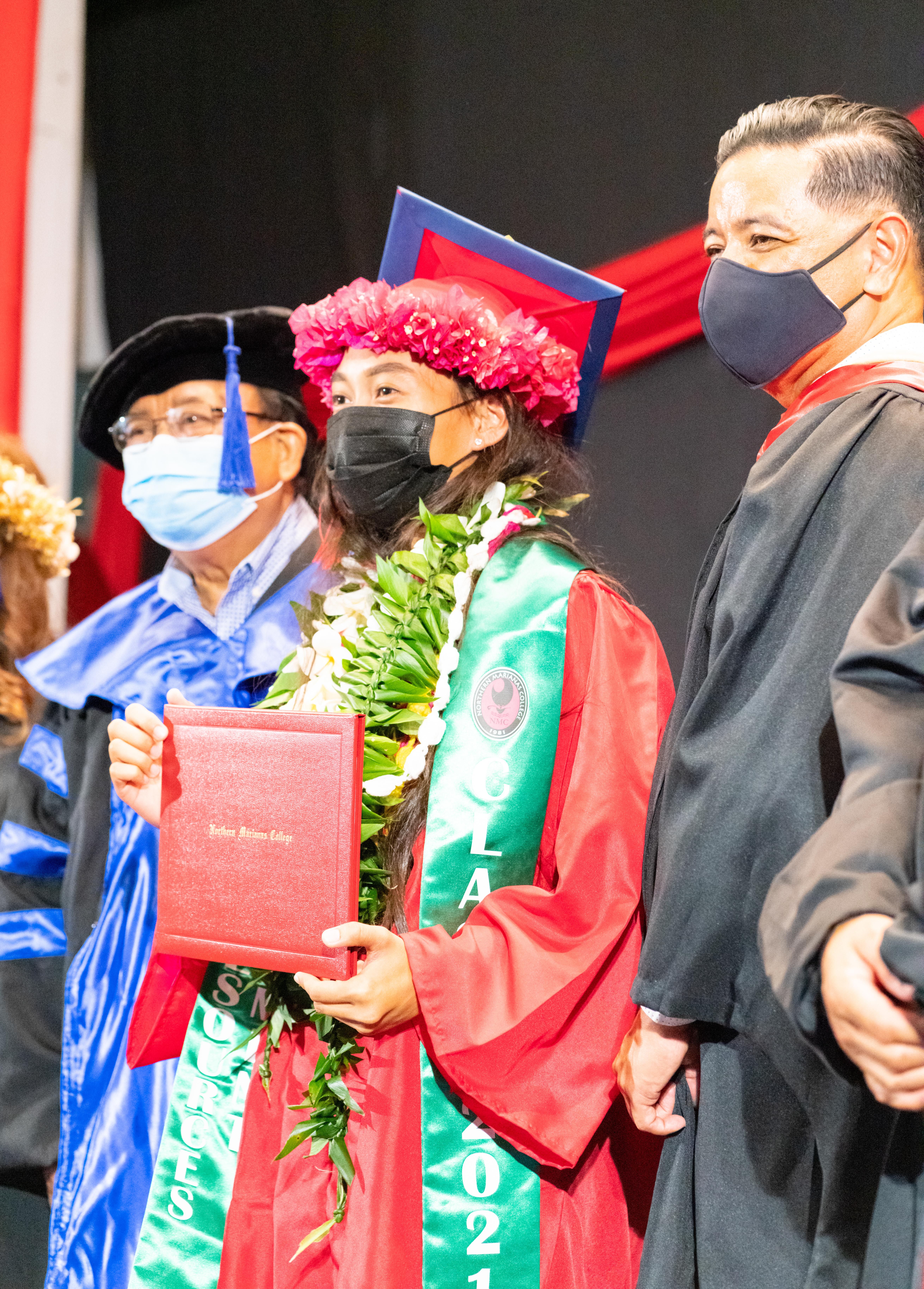 NMC student Catherine Calma poses with Interim President Frankie Eliptico, right, and other officials.