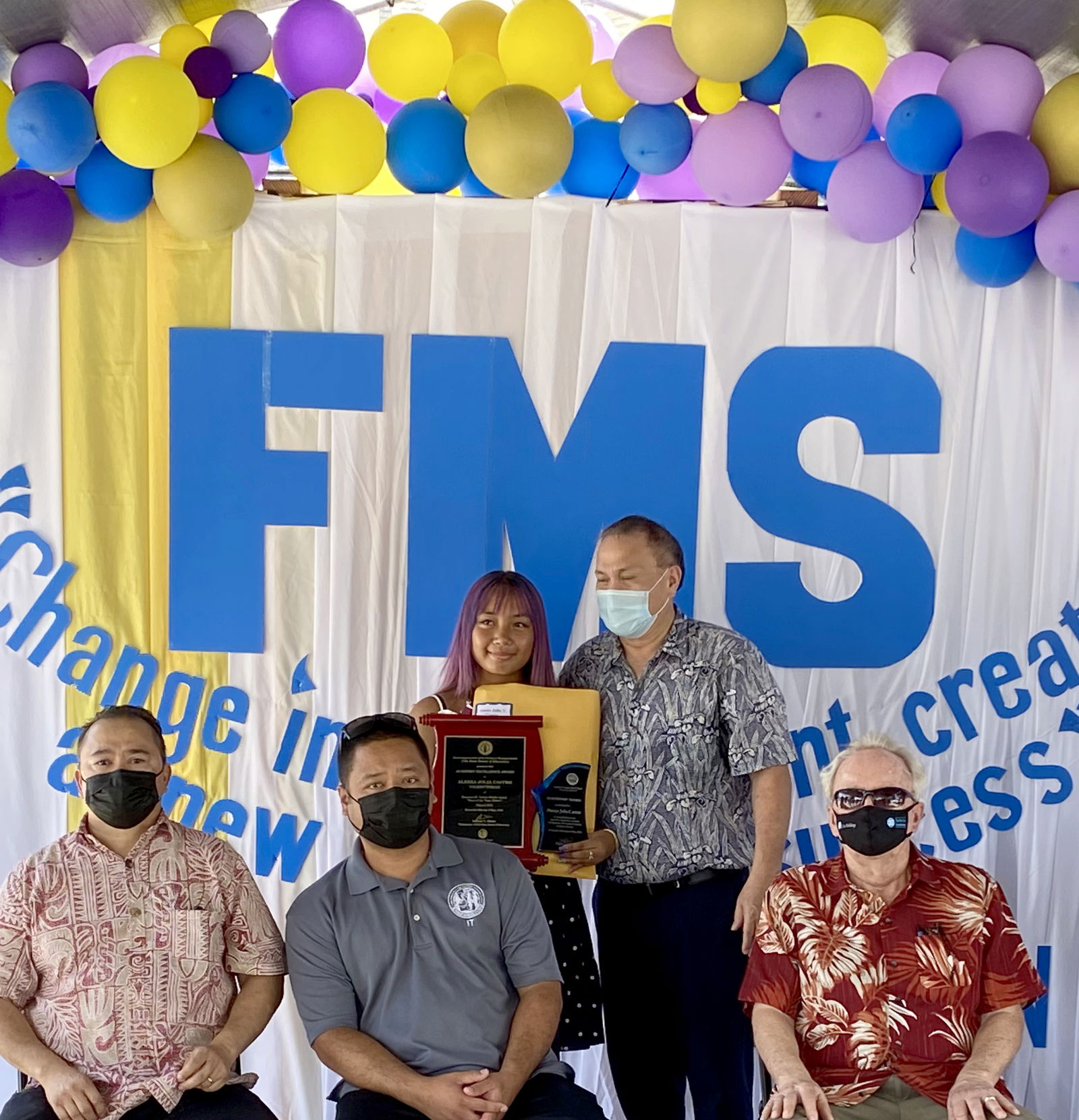 Francisco M. Sablan Middle School valedictorian Aleeza Jolia Castro with Board of Education Andrew Orsini,  Commissioner of Education Dr. Alfred B. Ada, Public School System State Infrastructure Technology Director Jesse Tenorio and Federal Programs Officer Tim Thornburgh.