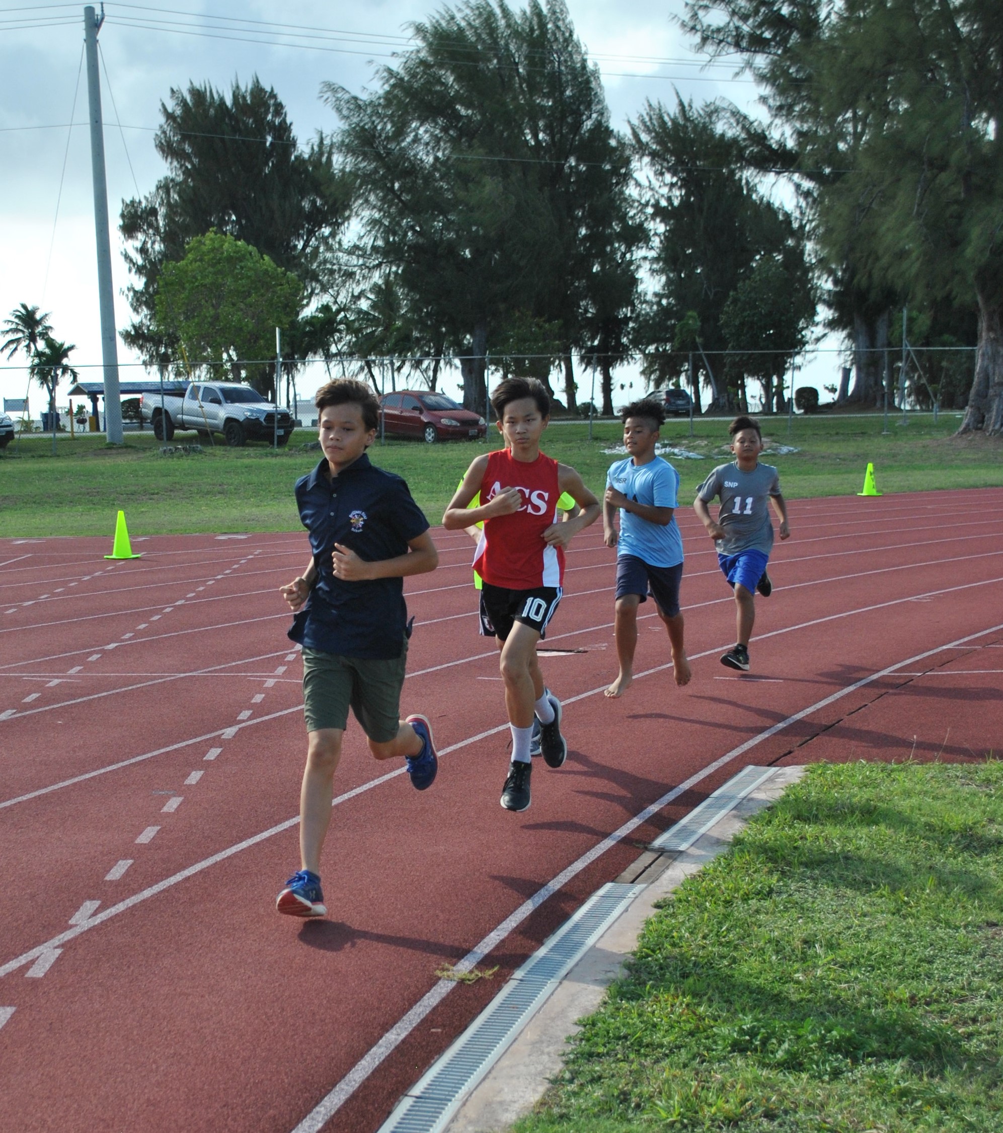Moshe Sikkel leads the 1500m run in the U12 age category of the McDonald's-PSS All School Elementary Track & Field Championships at the Oleai Sports Complex.Photo by James F. Sablan Jr.