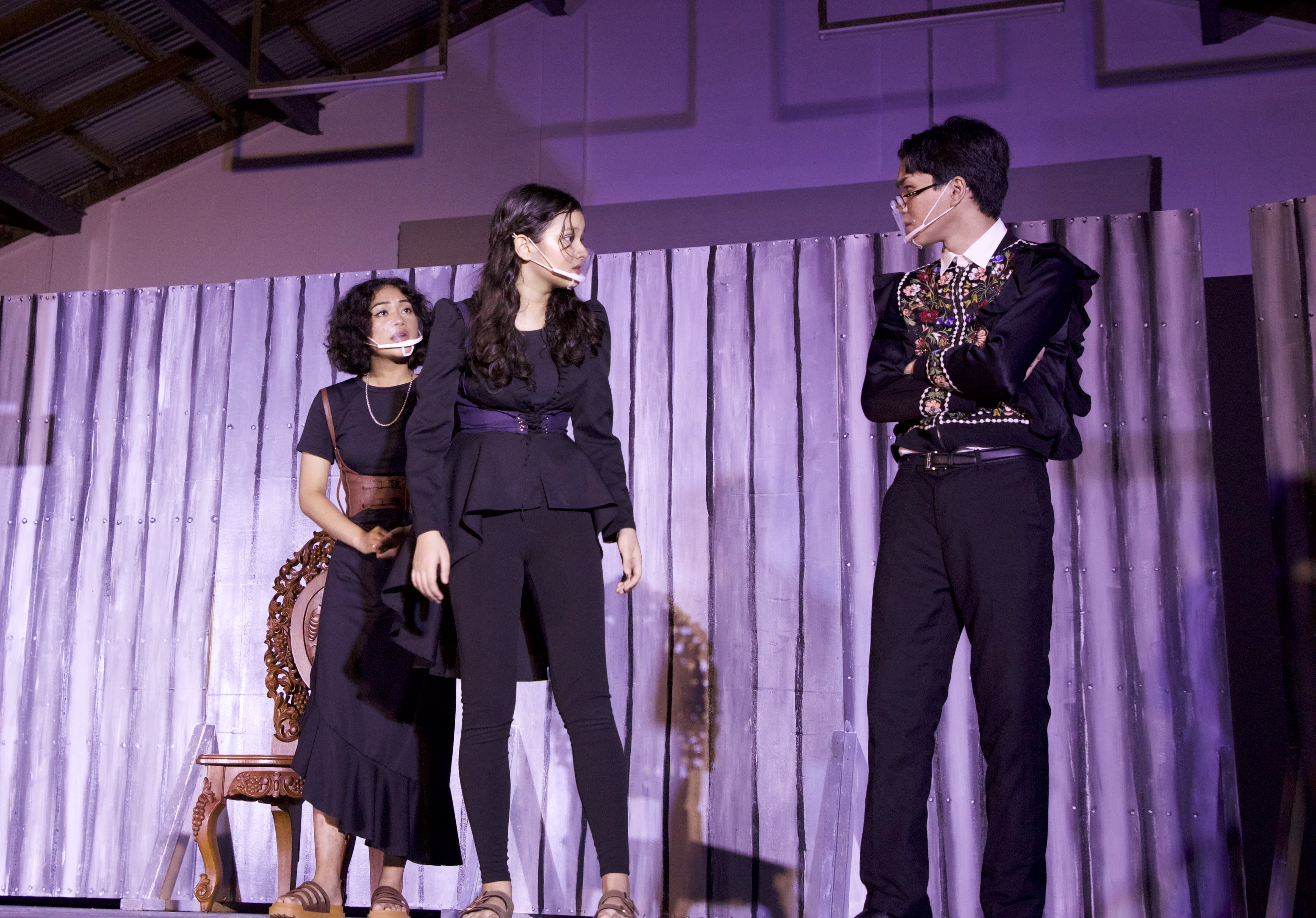 Duke Fredrick's daughter Celia, who is portrayed by Mount Carmel School sophomore Raven Driver, center, advises caution to the court's jester Touchstone, portrayed by Brent Ortizo, right. Also in photo: MCS sophomore Kina Dela Cruz, left, who portrays the lead role of Rosalind.