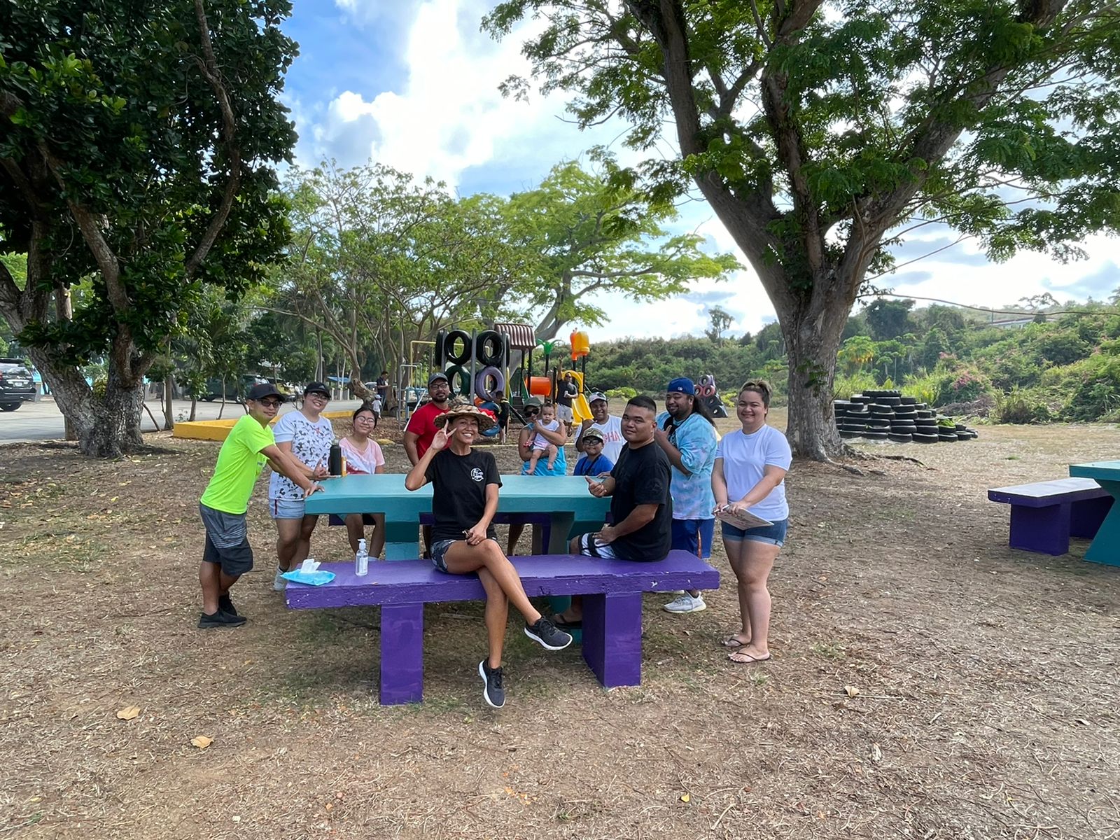 Members of the Kagman High School Class of 2006 pose for a group photo at Paupau Beach for their monthly beach cleanup.Contributed photo