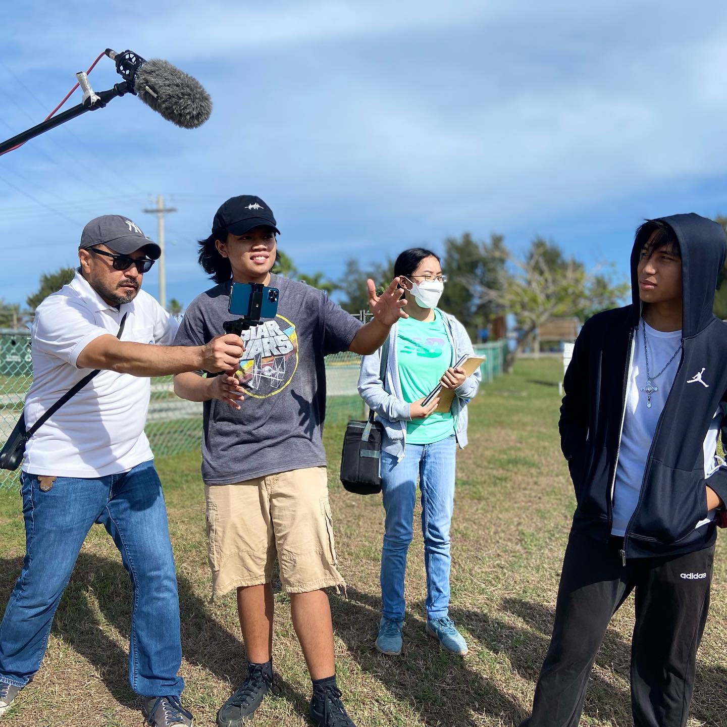 Mount Carmel School Junior, Jedric Villar, second left, directs a scene from the MCS Theatre Club’s forthcoming movie, “Zero2Hero,” which will reopen Hollywood Theaters on May 21.MCS photo
