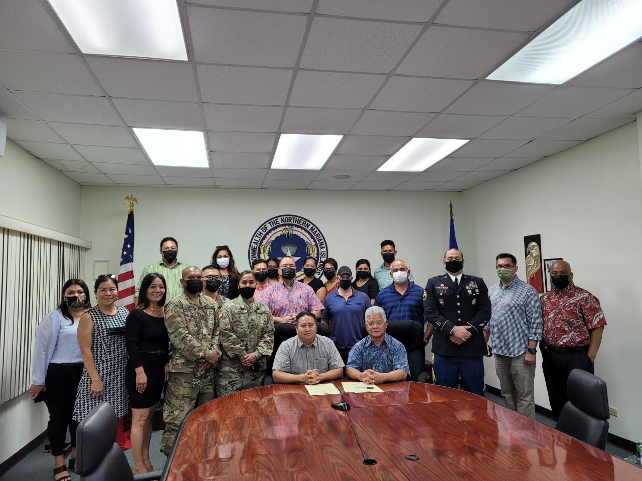 Gov. Ralph DLG Torres and Lt. Gov. Arnold I Palacios pose for a photo with Speaker Edmund S. Villagomez, Rep. Joseph Flores, other Commonwealth officials, servicemembers, including CNMI Army Recruitment Center’s Staff Sgt. Michael Ryan following the signing of the CNMI Armed Forces Day, Tuesday, in the governor’s conference room.Photo by Bryan Manabat