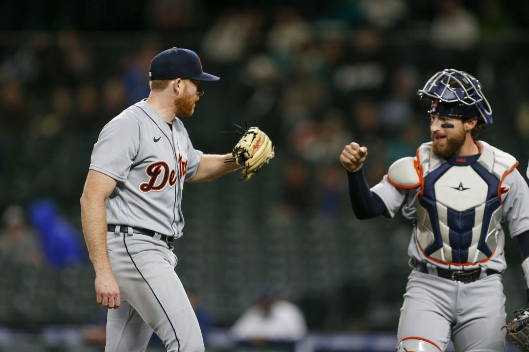 Detroit Tigers starting pitcher Spencer Turnbull (56, left) bumps fists with catcher Eric Haase (13) after getting a strikeout for the final out of the eighth inning against the Seattle Mariners at T-Mobile Park in Seattle, Washington state on May 18, 2021.Photo by Joe Nicholson-USA TODAY Sports