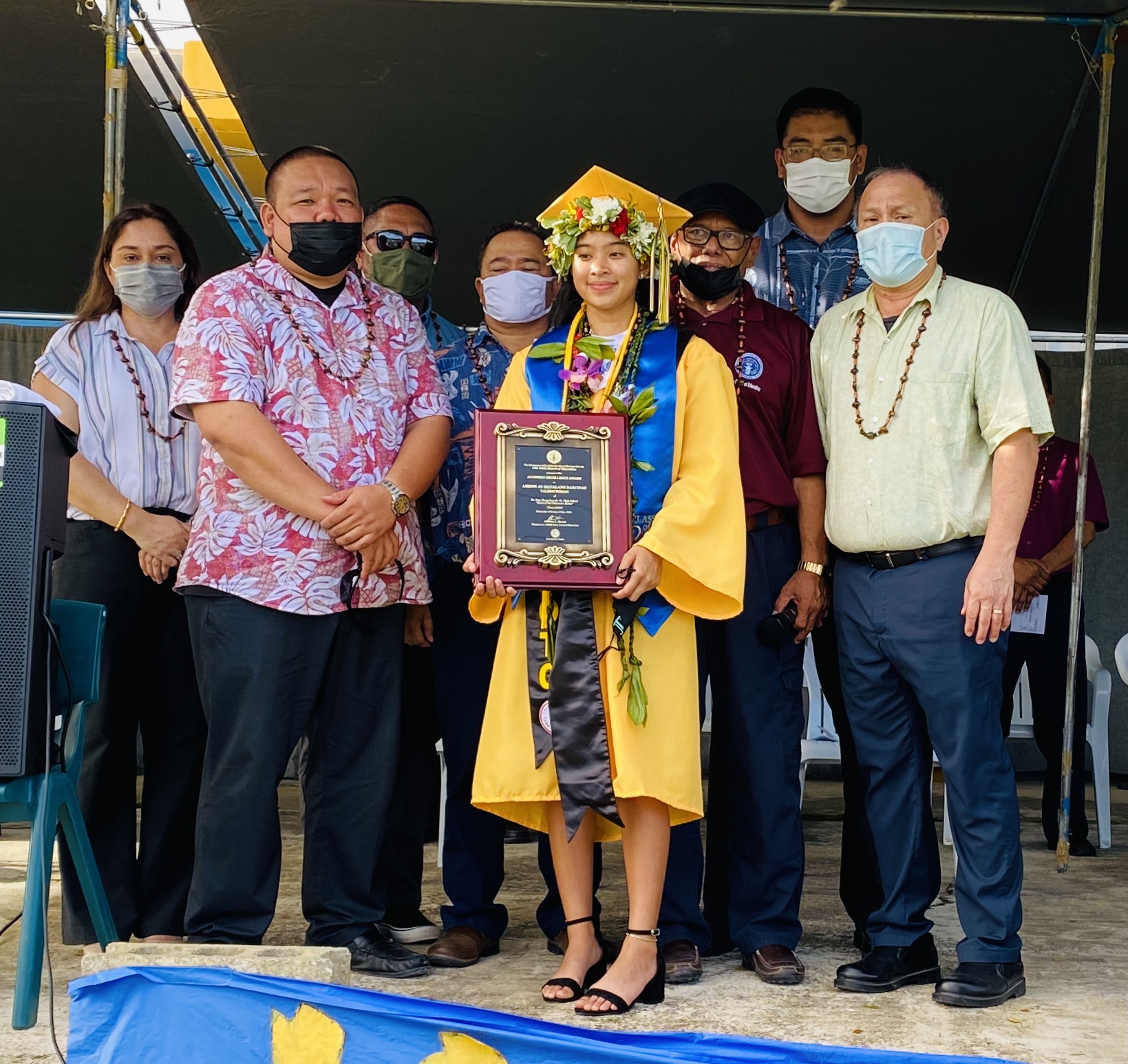 Dr. Rita Hocog Inos High School Class of 2021 valedictorian Amron Jo Manalang Barcinas poses for a photo with Board of Education Chairman Andrew L. Orsini, Vice Chairman Herman Atalig of Rota, BOE member Antonio Borja of Tinian, Commissioner of Education Dr. Alfred B. Ada, Associate Commissioner Eric Magofna, Public School System Special Education Program Director Donna Flores and Asapmar Ogumoro, PSS science program coordinator.