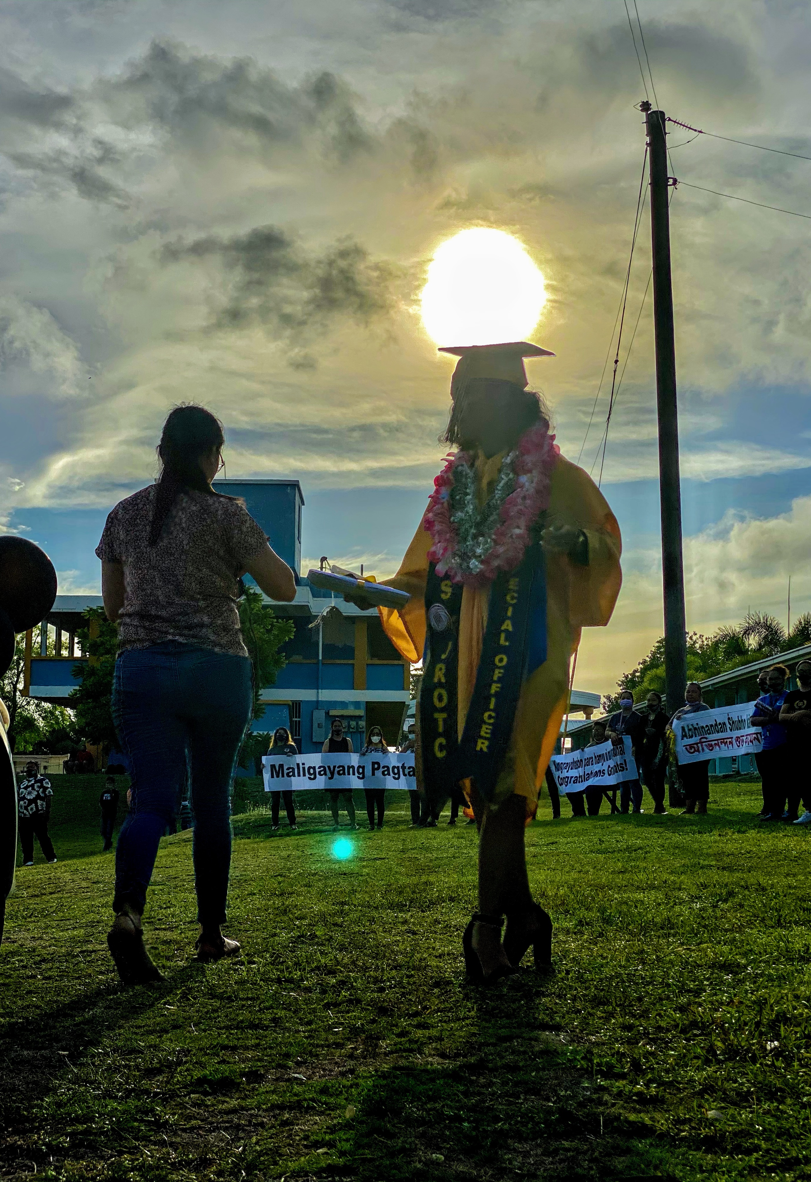 Like a spotlight, the sun shone brightly on the graduates
