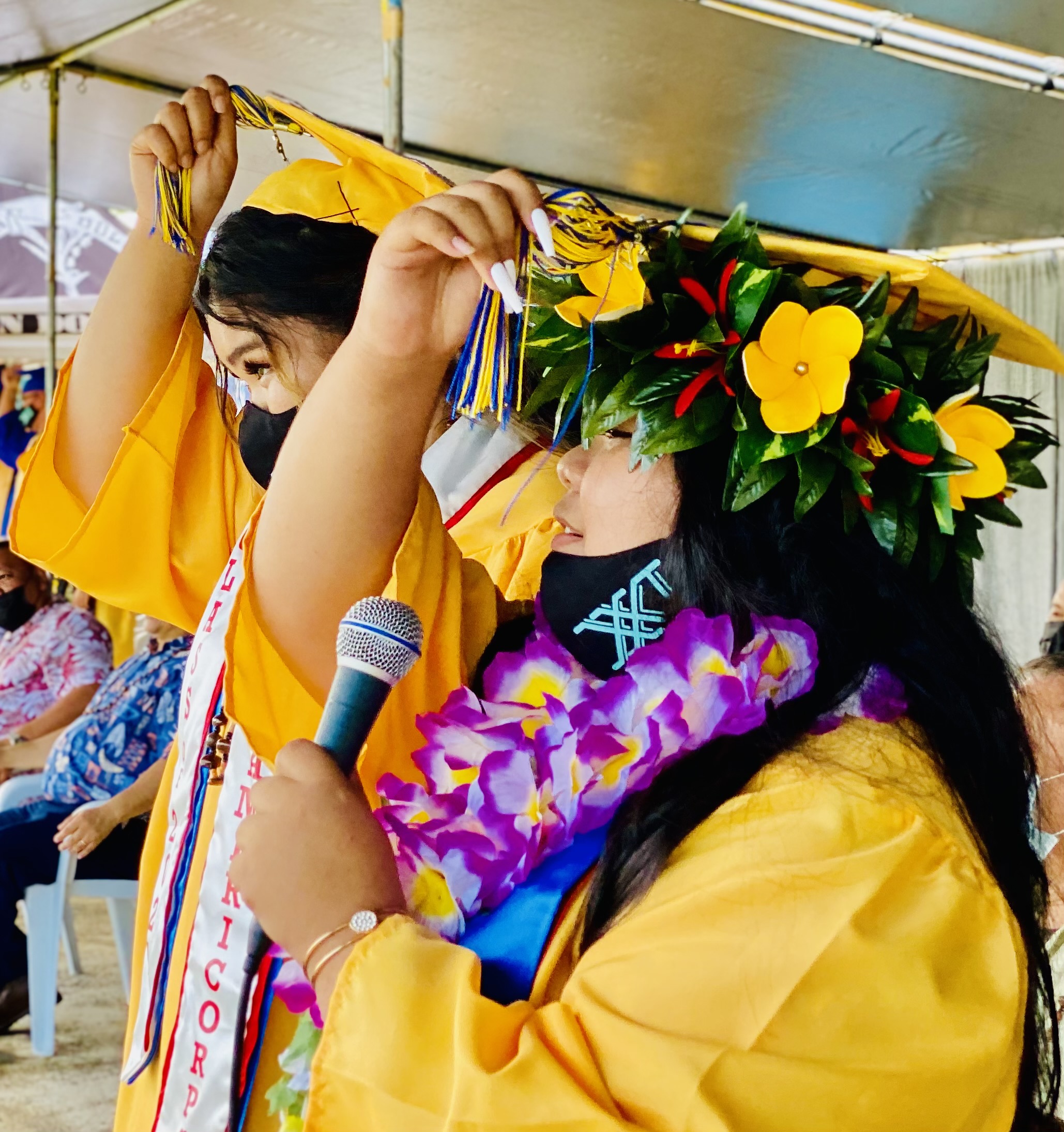 The graduates move their tassels.