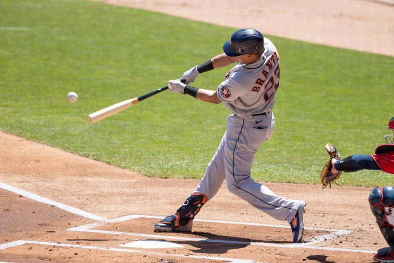 Houston Astros designated hitter Michael Brantley (23) hits a double during the first inning against the Minnesota Twins at Target Field in Minneapolis, Minnesota on June 13, 2021.