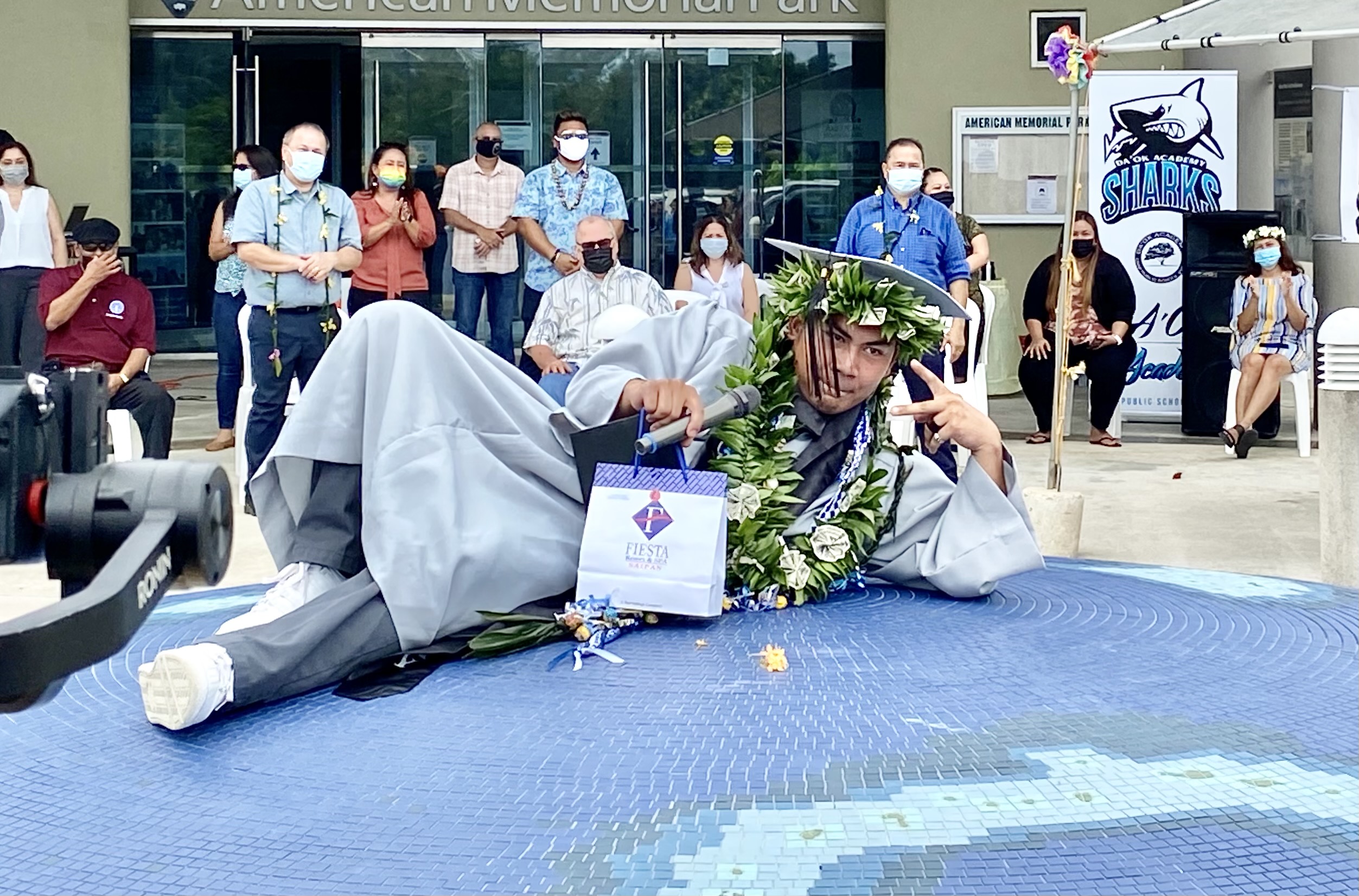 A graduate hams it up for the camera.