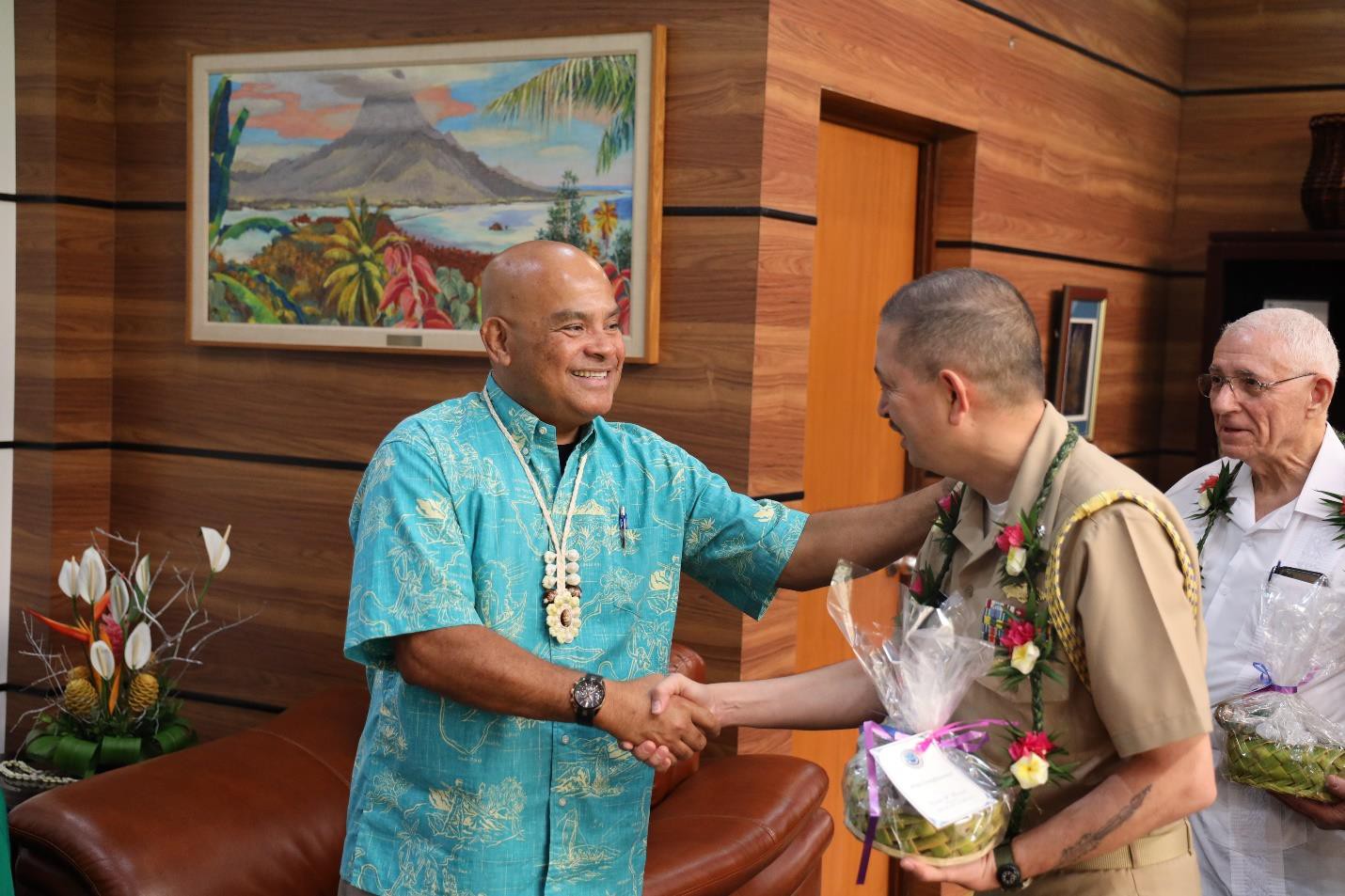 FSM President David W. Panuelo shakes hands with the U.S. defense attaché, Cmdr. Thomas Price.