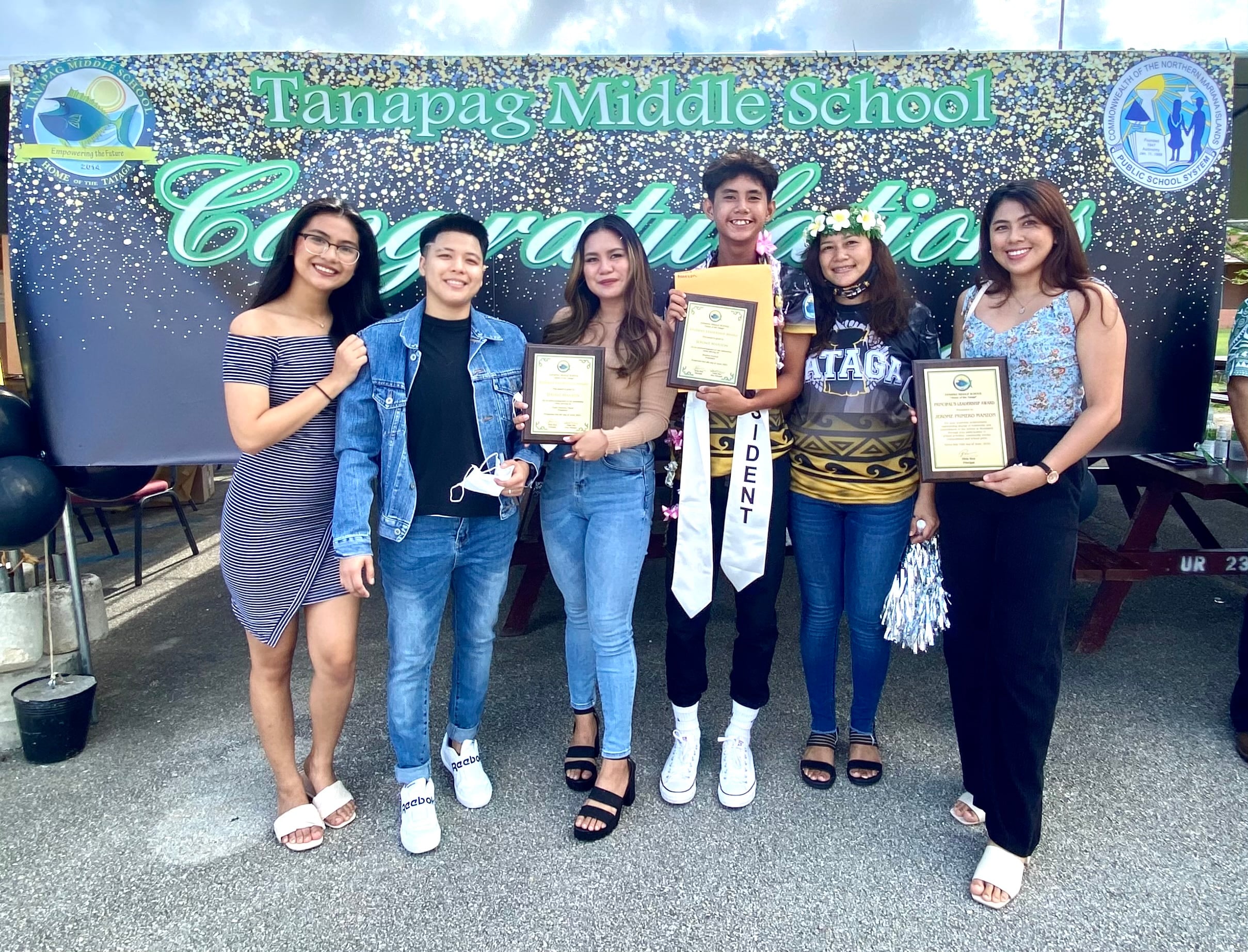 Tanapag school principal Hilda Rios with Principal’s Leadership awardee Jerome Manzon,   his family and friends.