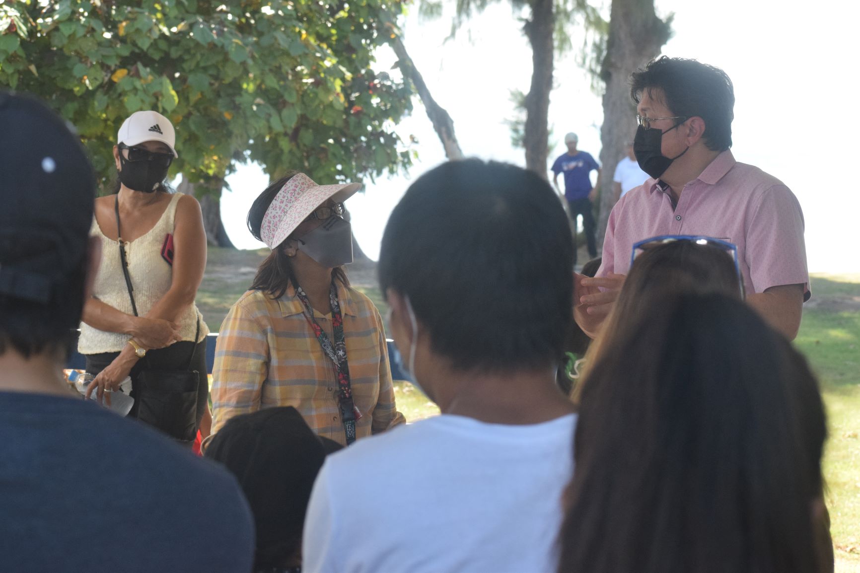 Rep. Edwin Propst speaks with members of the CNMI PUA Group at Kilili Beach on Thursday.