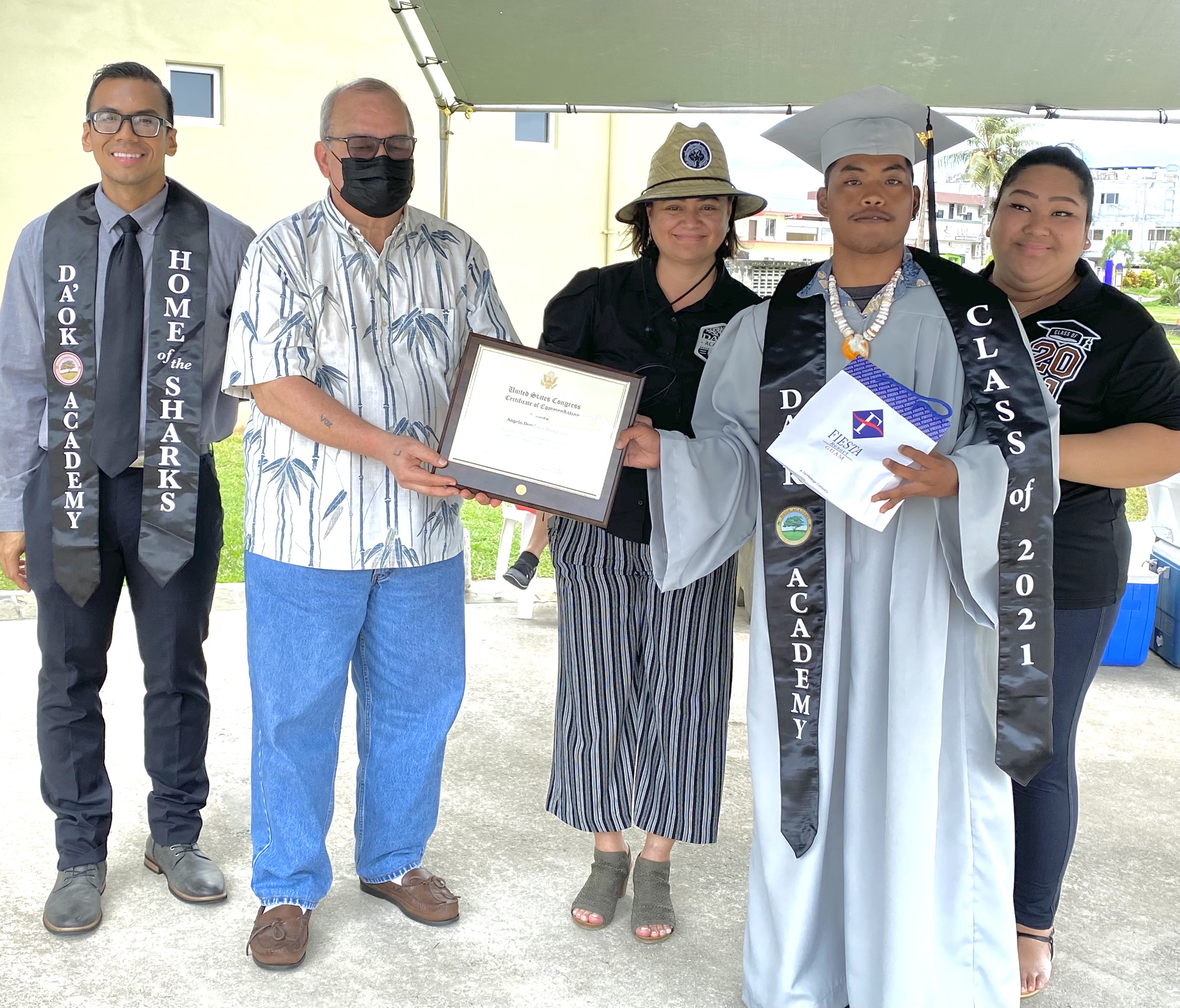 Angelo Doming Manglona receives a U.S. Congressional Commendation from U.S. Congressman Gregorio Kilili Camacho Sablan. Joining them in the photo are Da’ok Academy principal Christine Tudela, Marianas High School principal Jonathan Aguon and Da’ok Academy counselor Audrey King.