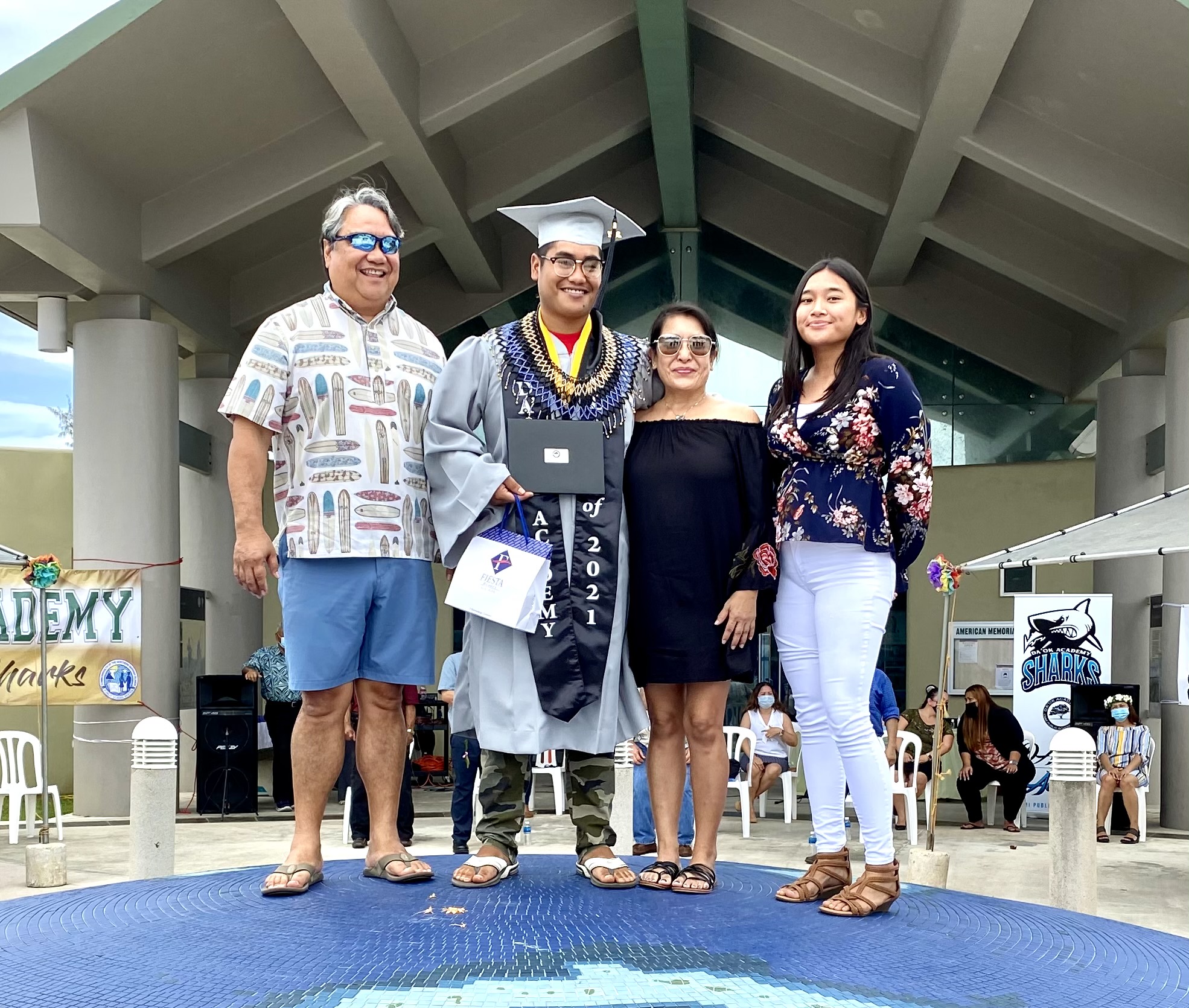 Nicholas Ramon Ada, who is pursuing higher education at Northern Marianas College, poses with his family.