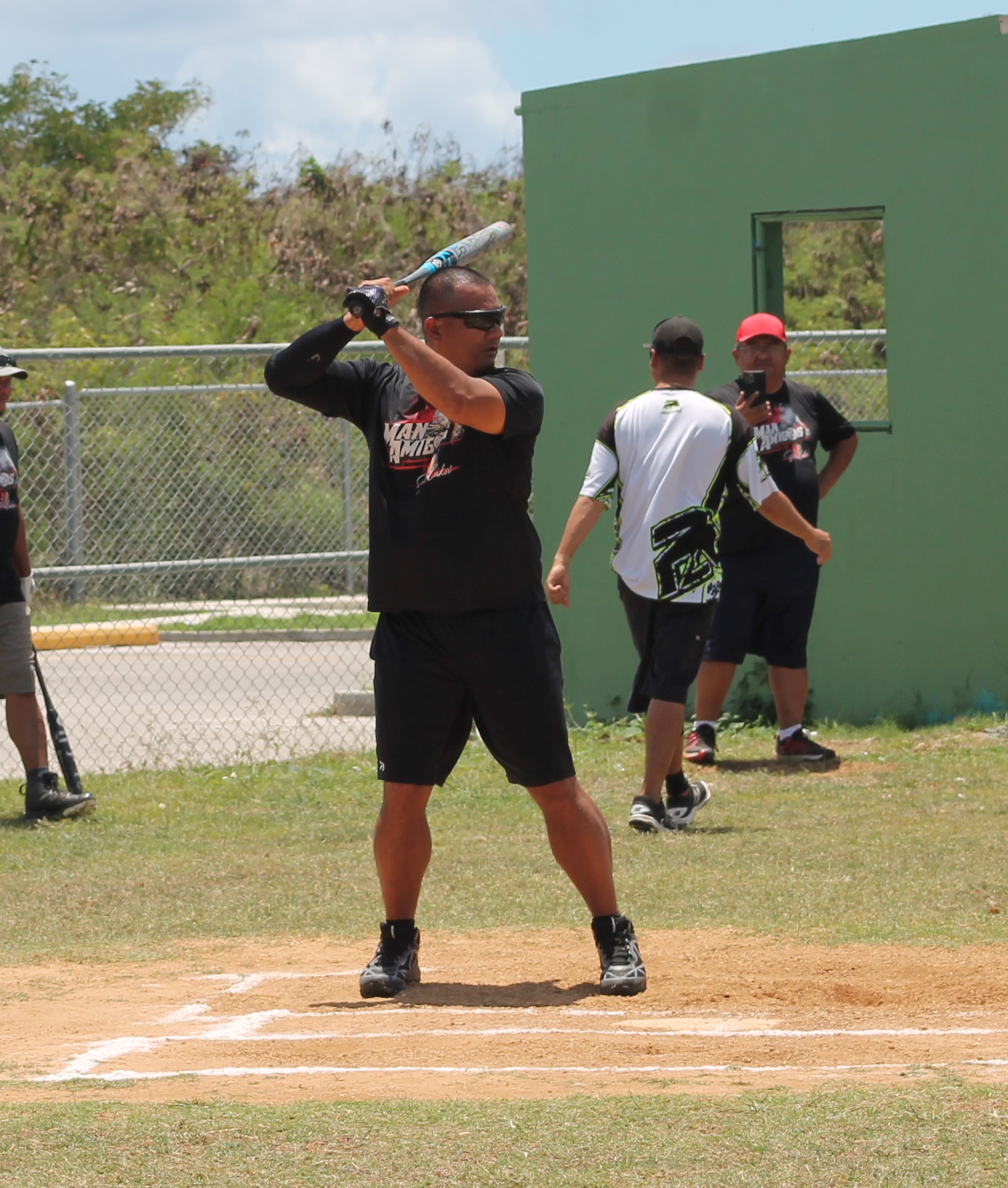 Man Amigos' Mark Toves gets ready at the batter's box.