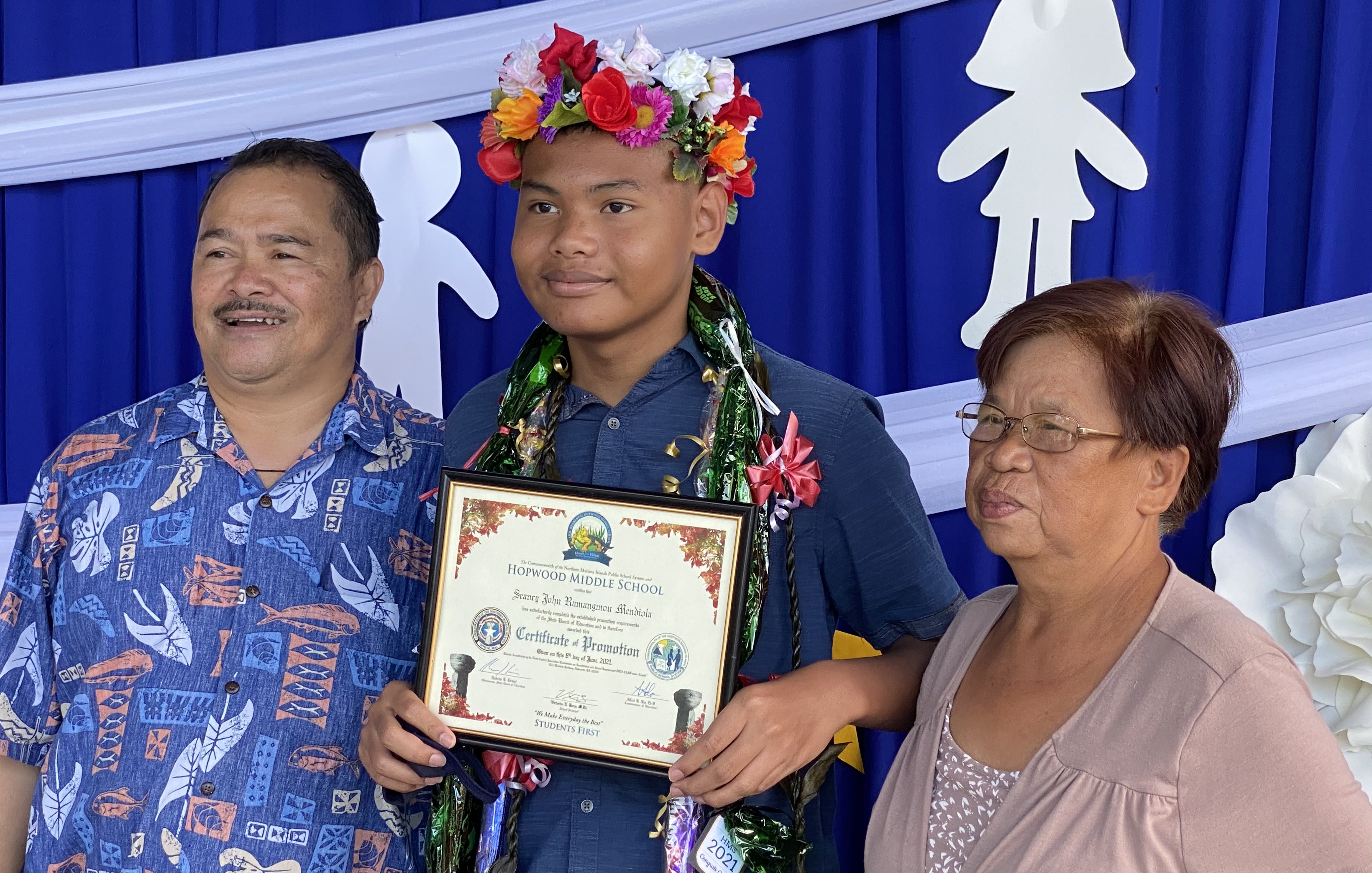 Commissioner of Education Dr. Alfred B. Ada with Seancy John R. Mendiola and a family member.