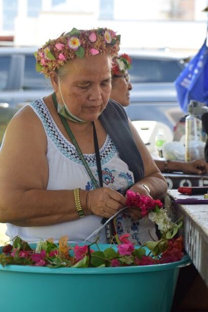 Domie Taisakan chooses the best flowers for her mwars.
