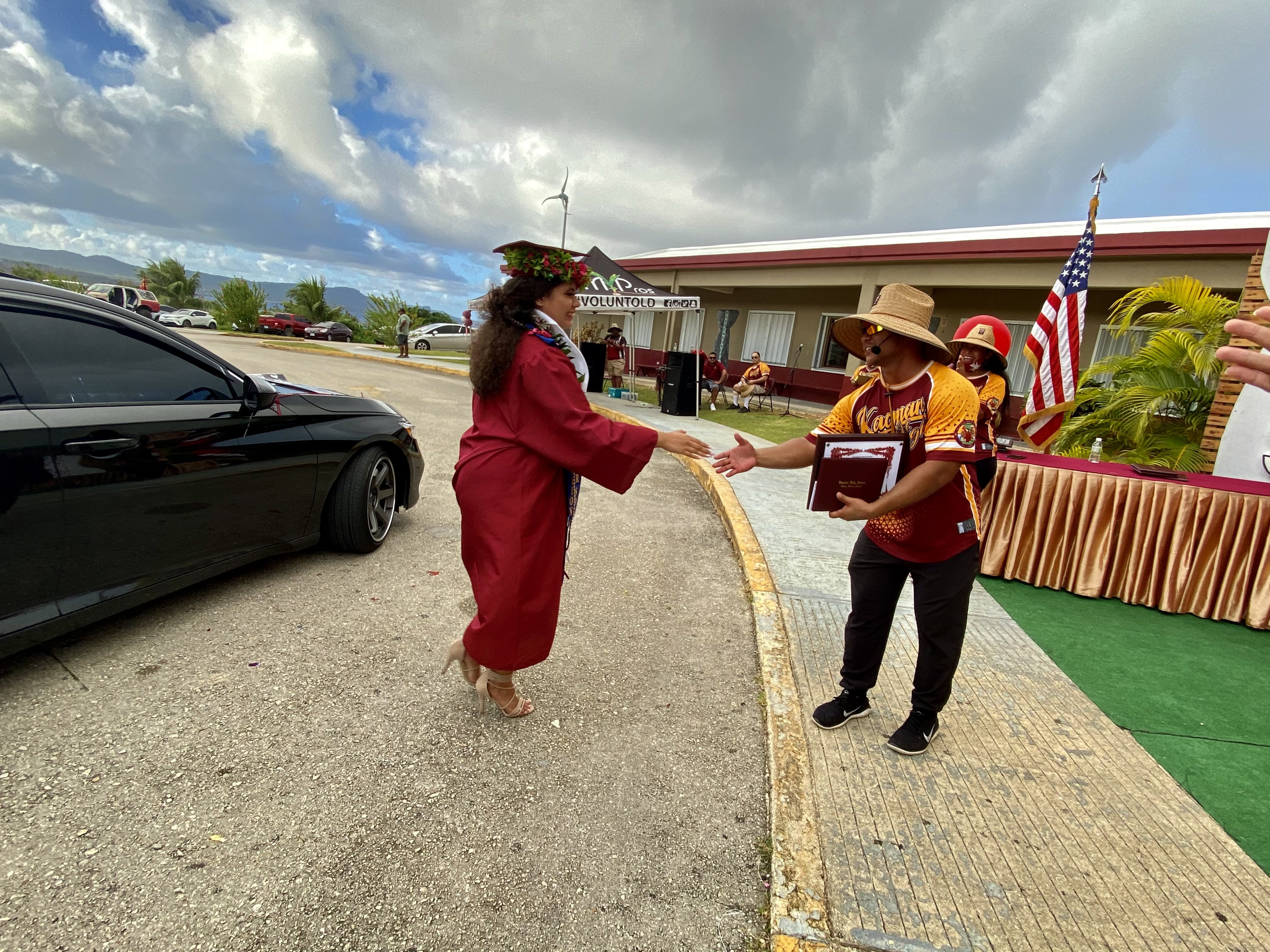 A member of the Class of 2021 receives her diploma from KHS principal Ben Jones during a drive-thru ceremony.
