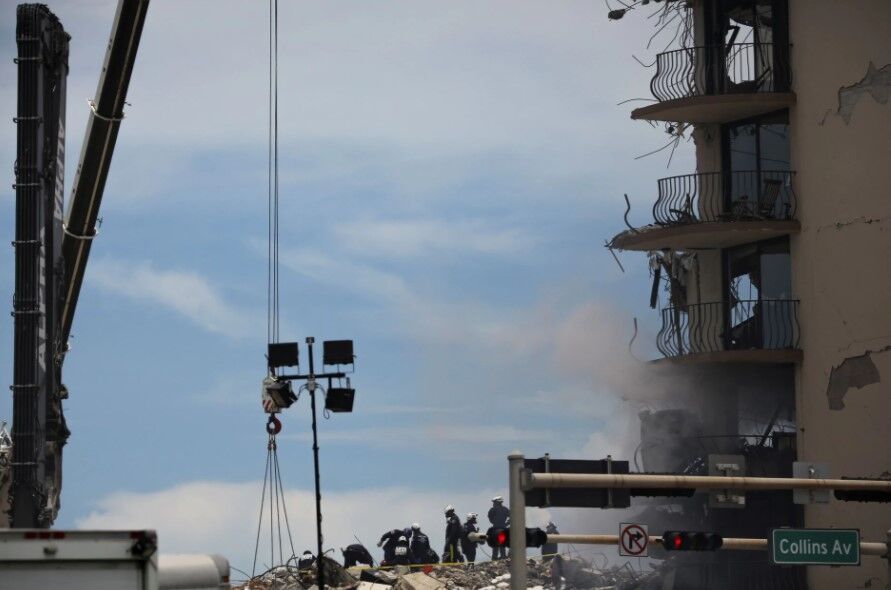 Rescue personnel continues search and rescue operations for survivors of a partially collapsed residential building in Surfside, near Miami Beach, Florida,  June 26, 2021. 