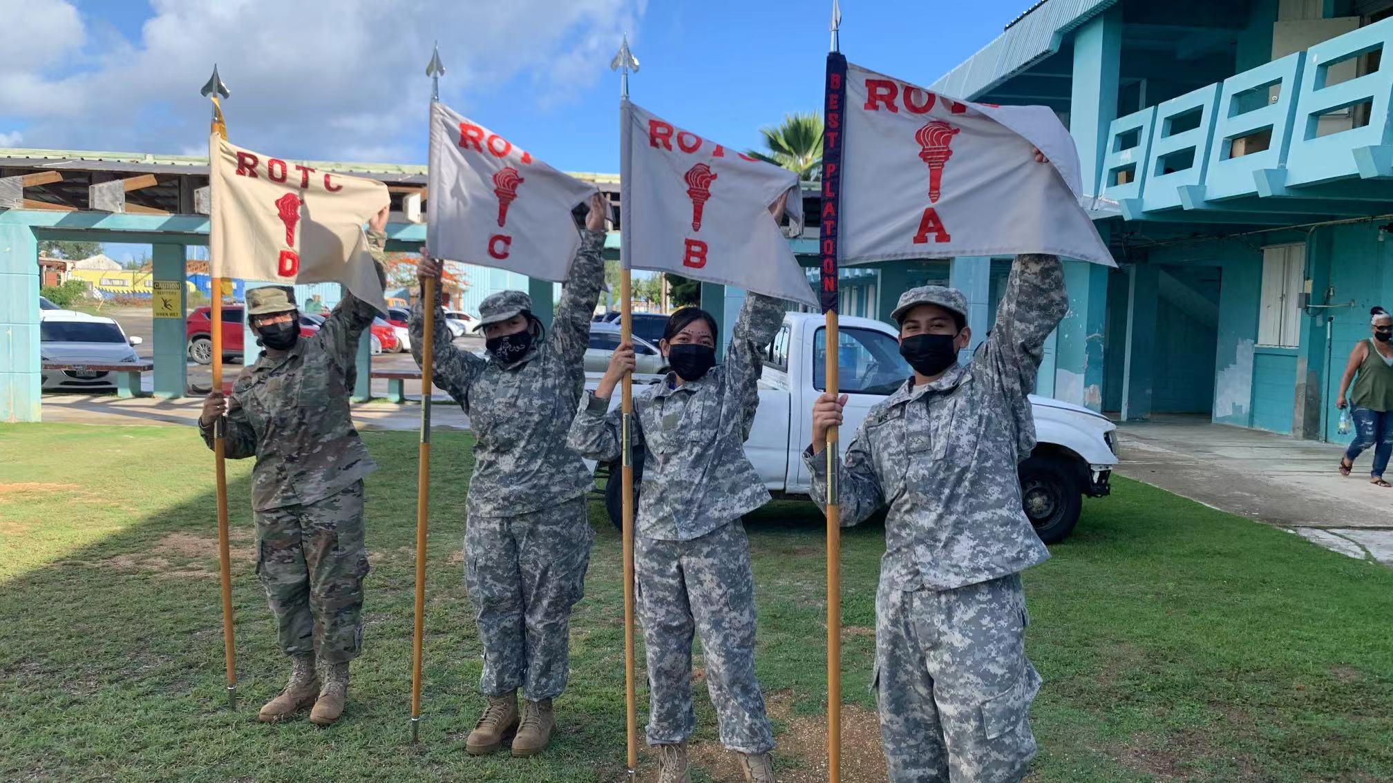 Company guidons pose for a photo.
