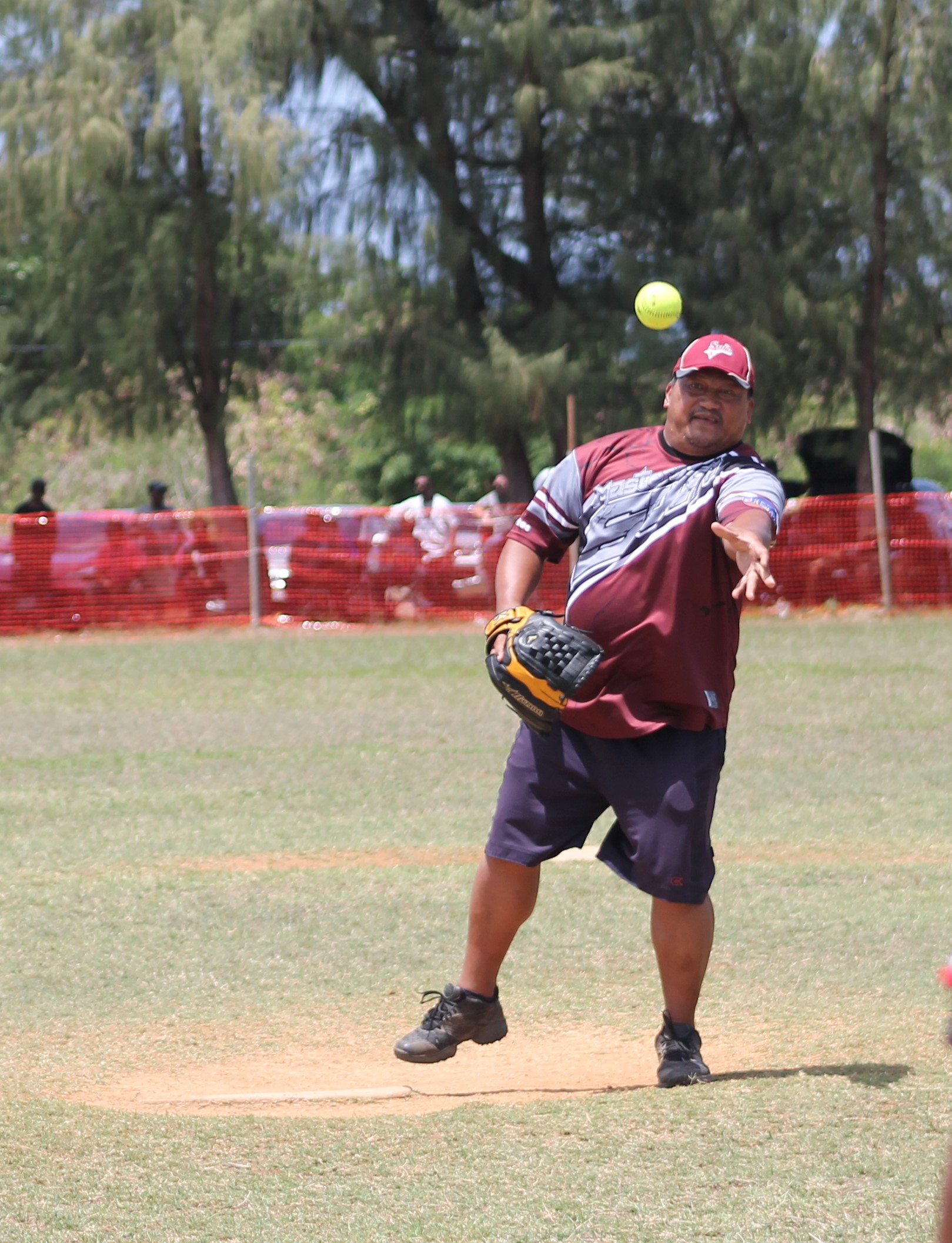 SUFA's Tom pitches against PeLeLiu during a Belau Amateur Softball League game at the Dandan baseball field.