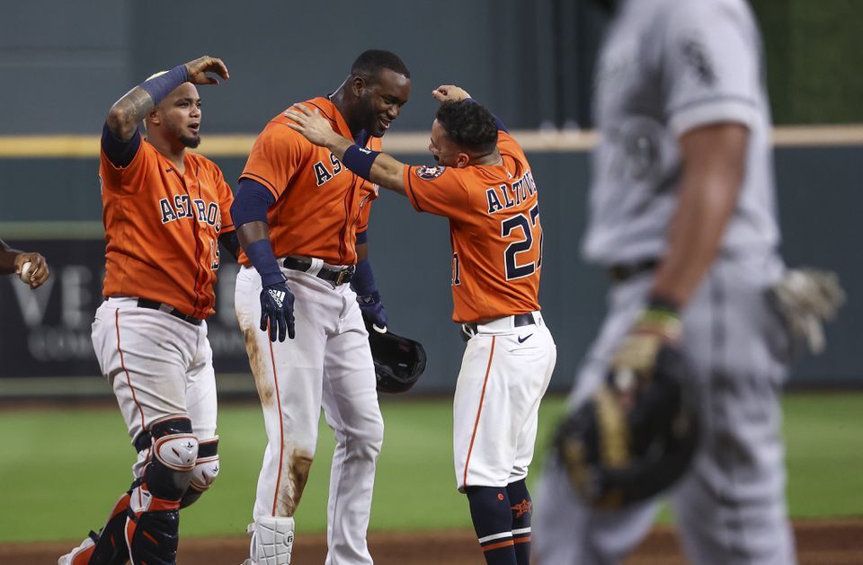 Houston Astros designated hitter Yordan Alvarez (44) celebrates with teammates after driving in a run during the ninth inning against the Chicago White Sox at Minute Maid Park  in Houston on June 18, 2021. 