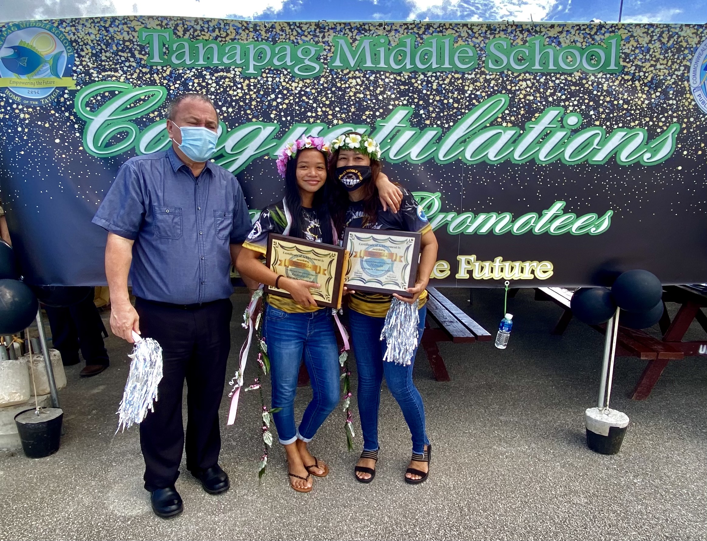 Student Ha’ani Salas with her proud mother, school principal Hilda Rios, and Board of Education Chairman Andrew Orsini.