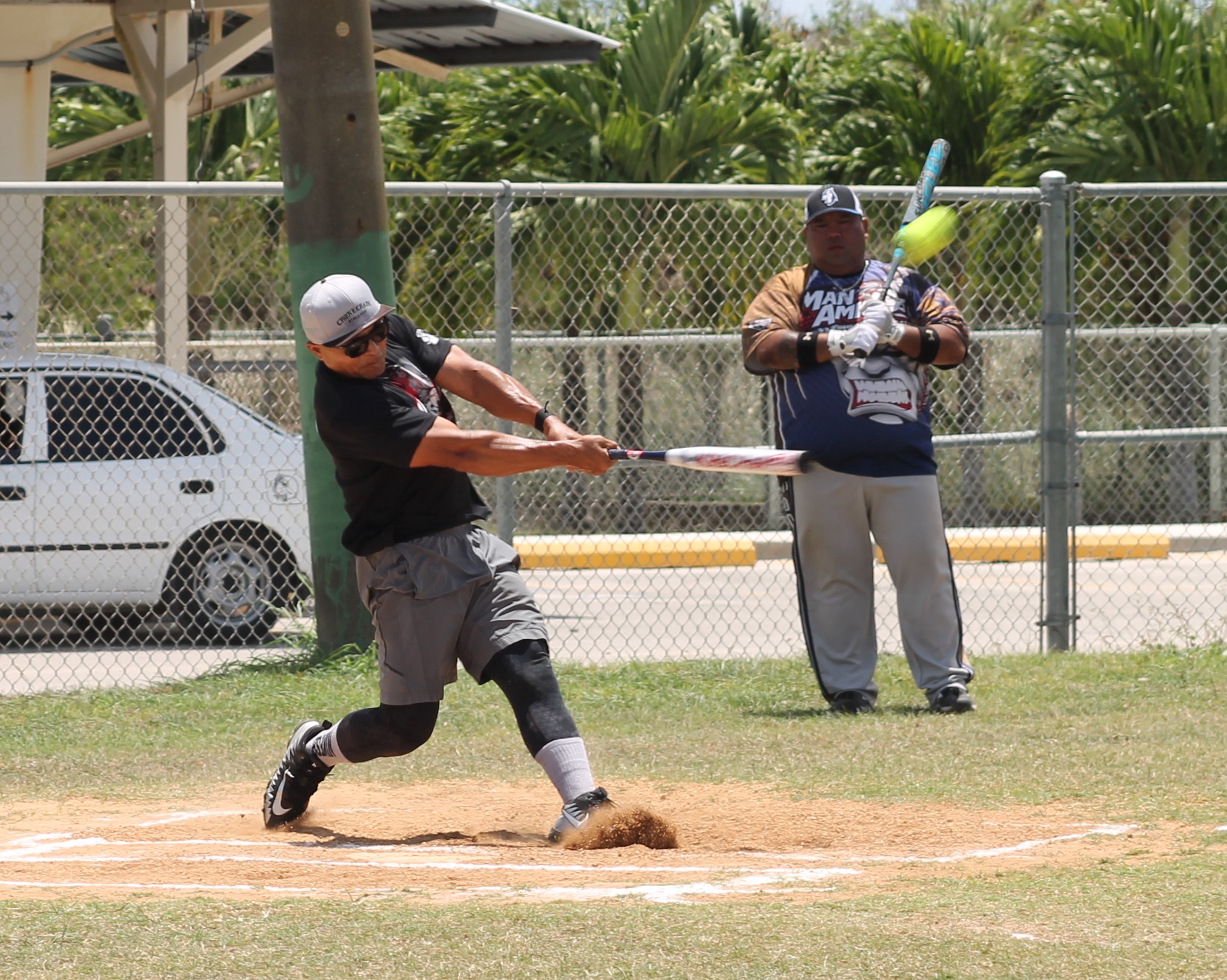 The Man Amigos’ Pete connects the solo home run during  game 1 of the Belau Amateur Softball League championship on Sunday at the Dandan baseball field.