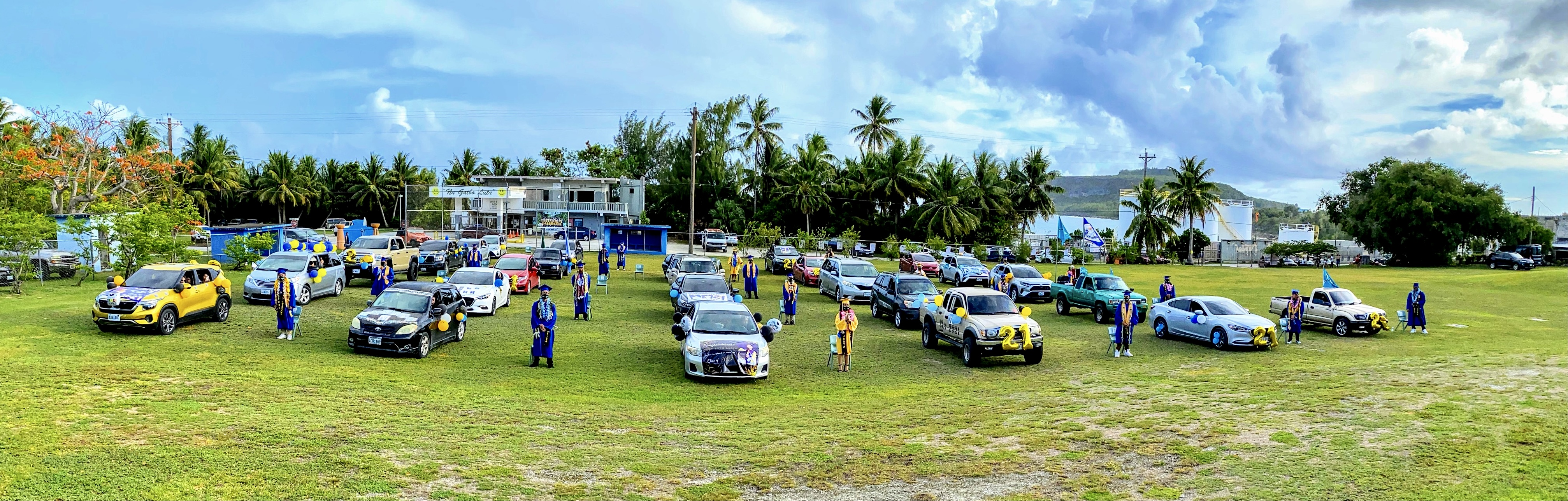 The seniors  pose for a group photo during their graduation ceremony on campus.