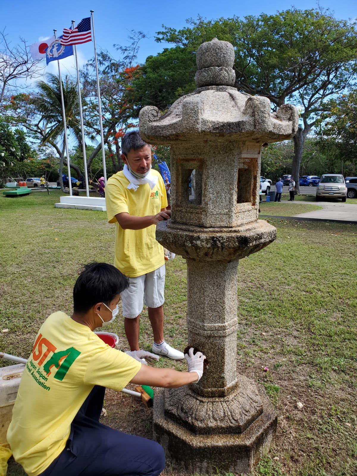 Volunteers of Japan Saipan Travel Association clean the Korea Peace Memorial on May 29, 2021 in Marpi, Saipan.